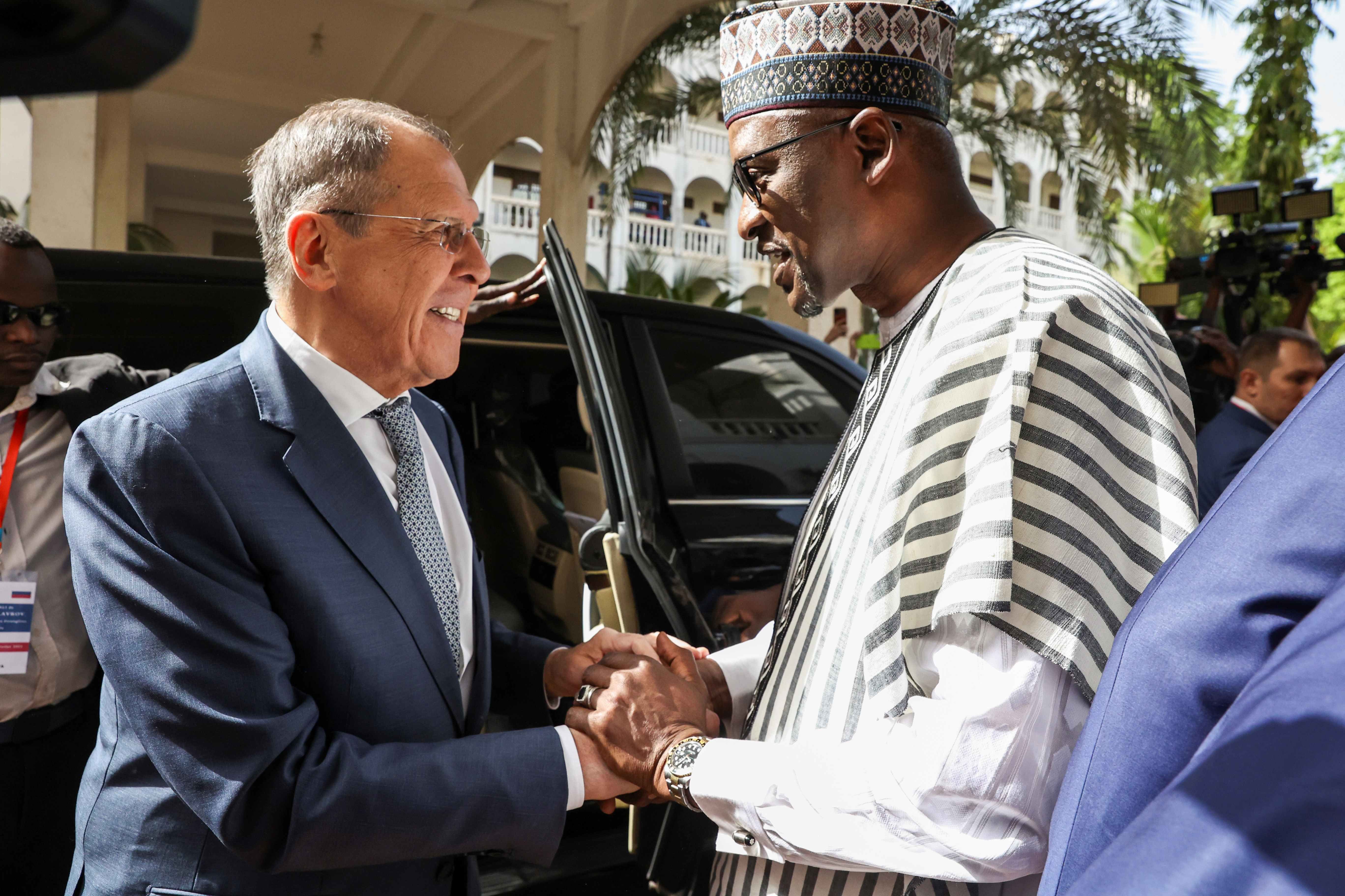 Mali's Foreign Minister Abdoulaye Diop, right, welcomes Russia's Foreign Minister Sergey Lavrov during their meeting in Bamako, Mali, February 7, 2023. 