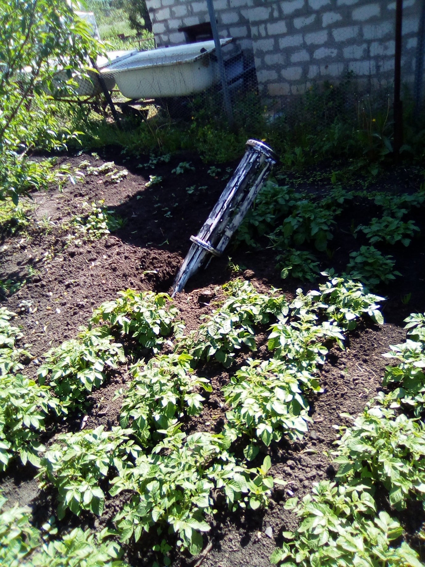 The carrier section of an 9M27K-series Uragan rocket that landed outside the home of a woman living on left bank of the Siverskiy Donets River while Russian forces occupied the area in 2022.  Each rocket delivers 30 9N210 or 9N235 submunitions. 