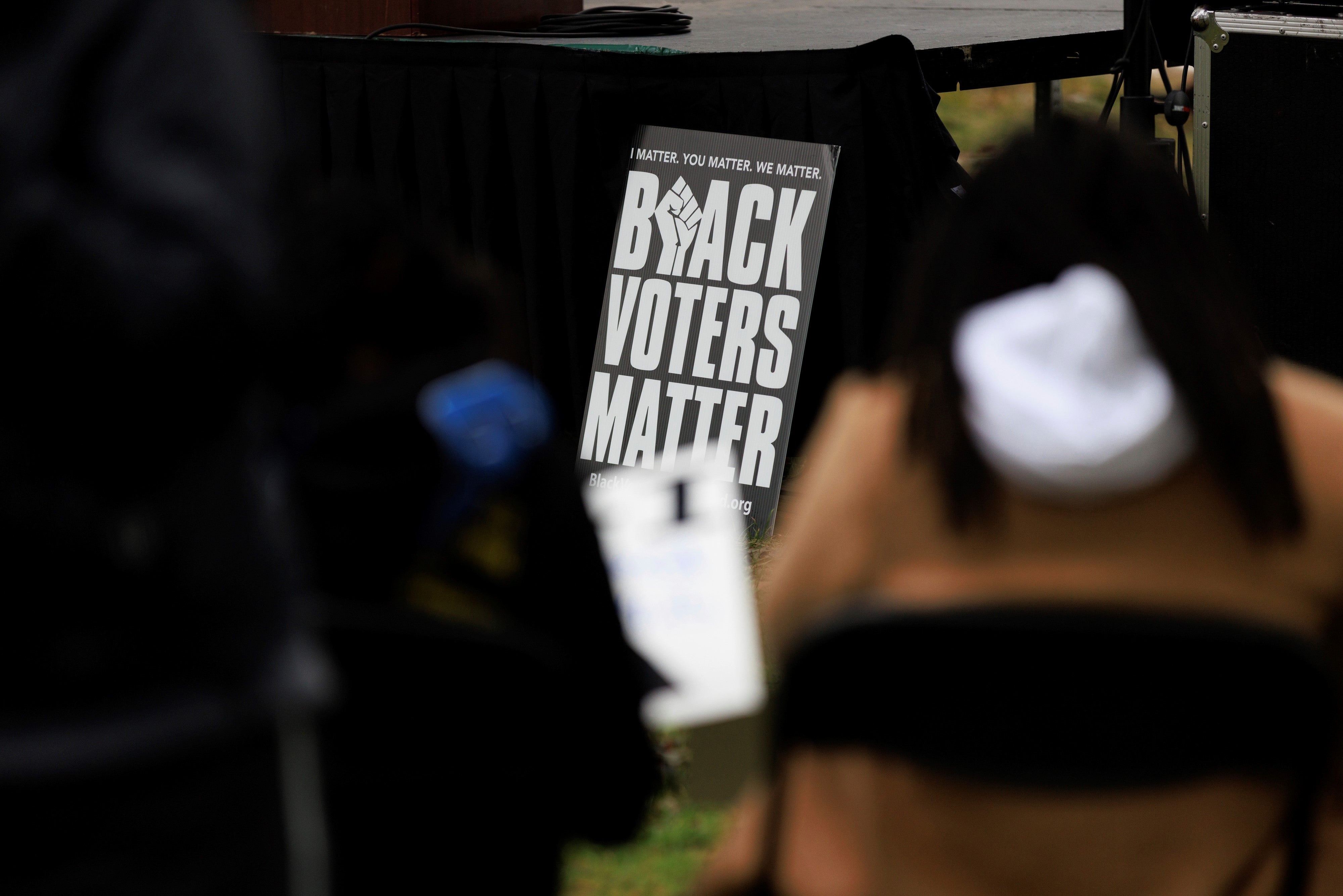 People attend a rally held by the Southern Poverty Law Center near the U.S. Capitol on October 4, 2022