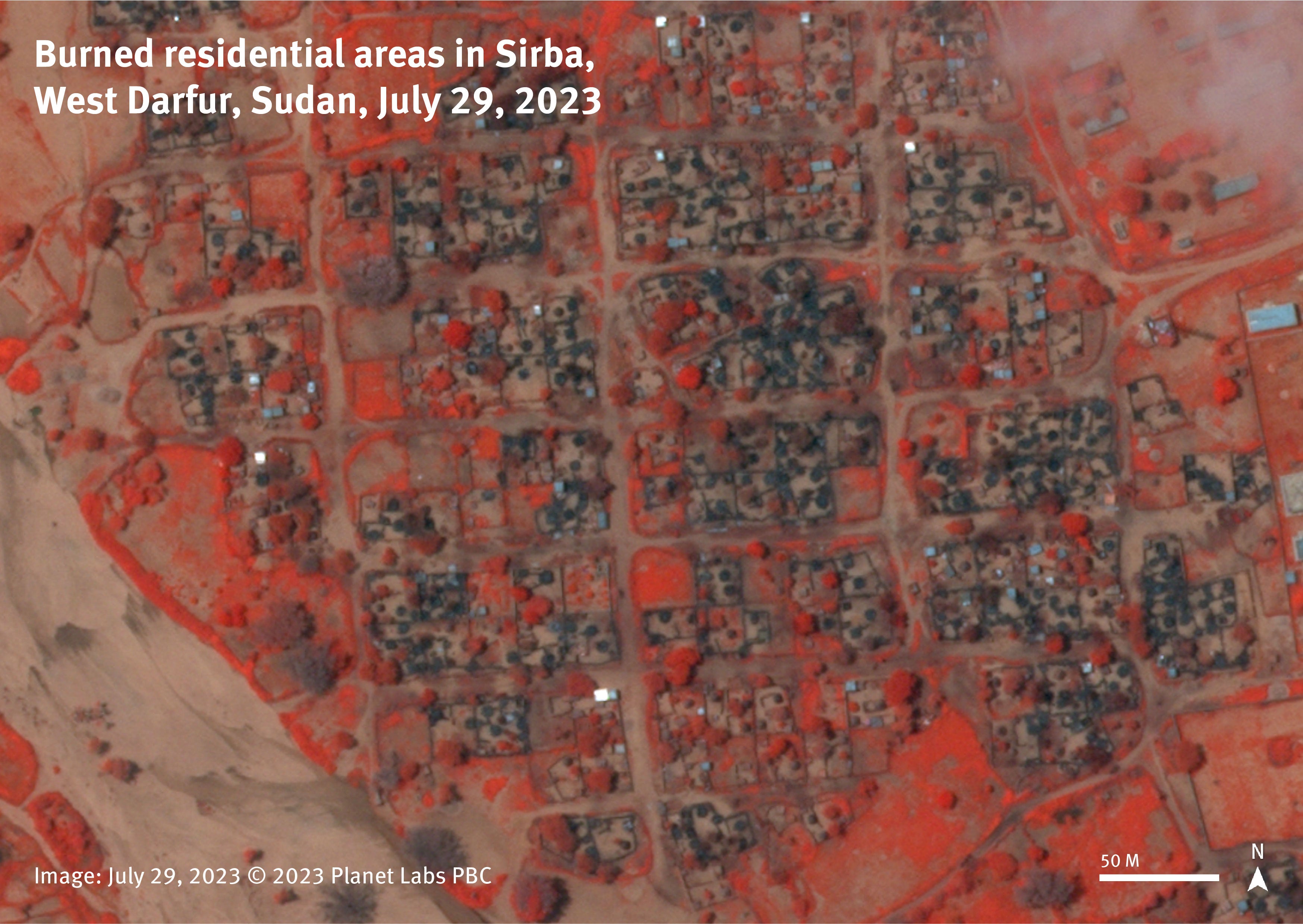 Infrared satellite image from July 29, 2023, shows a burned residential area in the town of Sirba, West Darfur, Sudan. On infrared images, the vegetation appears in red and the burned areas more clearly in a darker color.