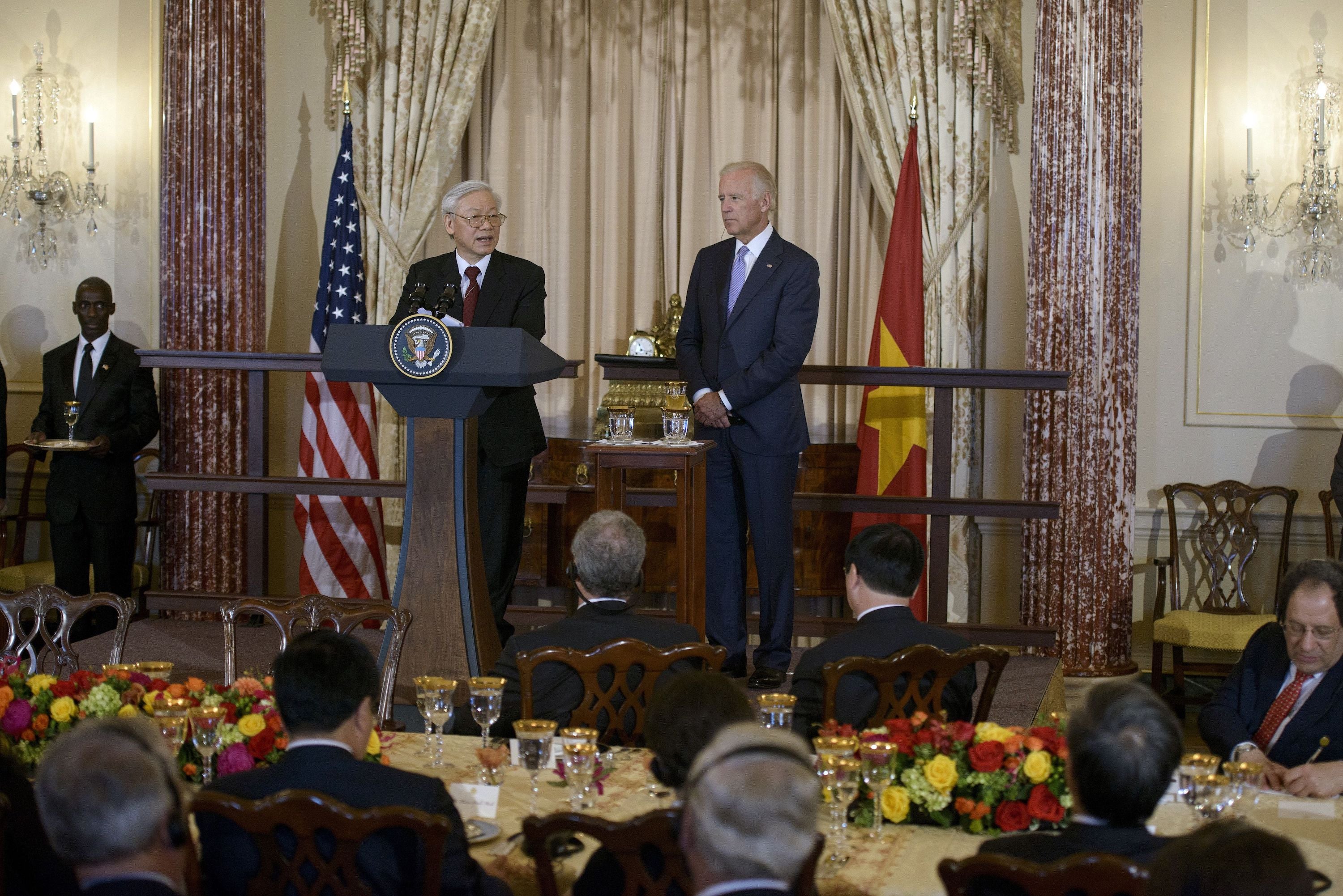 Vietnamese Communist Party General Secretary Nguyen Phu Trong, left, speaks before a luncheon with then United States Vice President Joe Biden at the US State Department, Washington, DC, July 7, 2015.