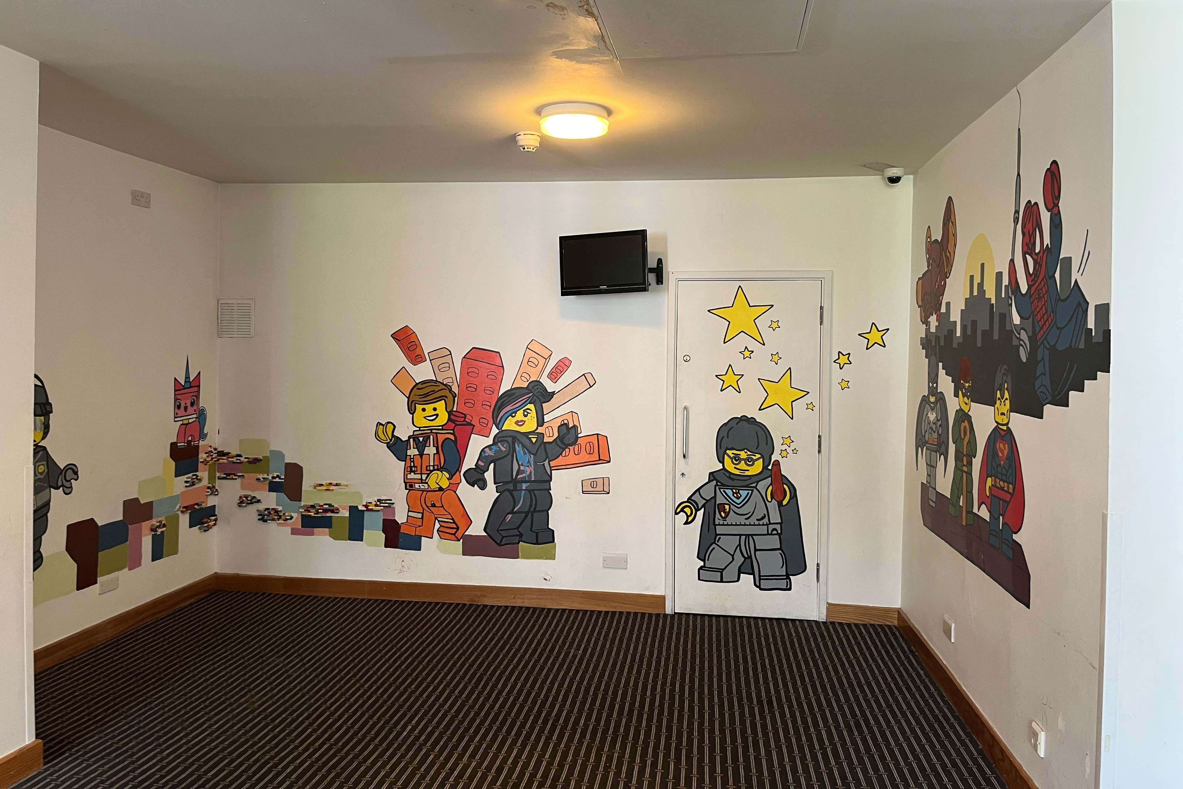 Empty room with lego murals