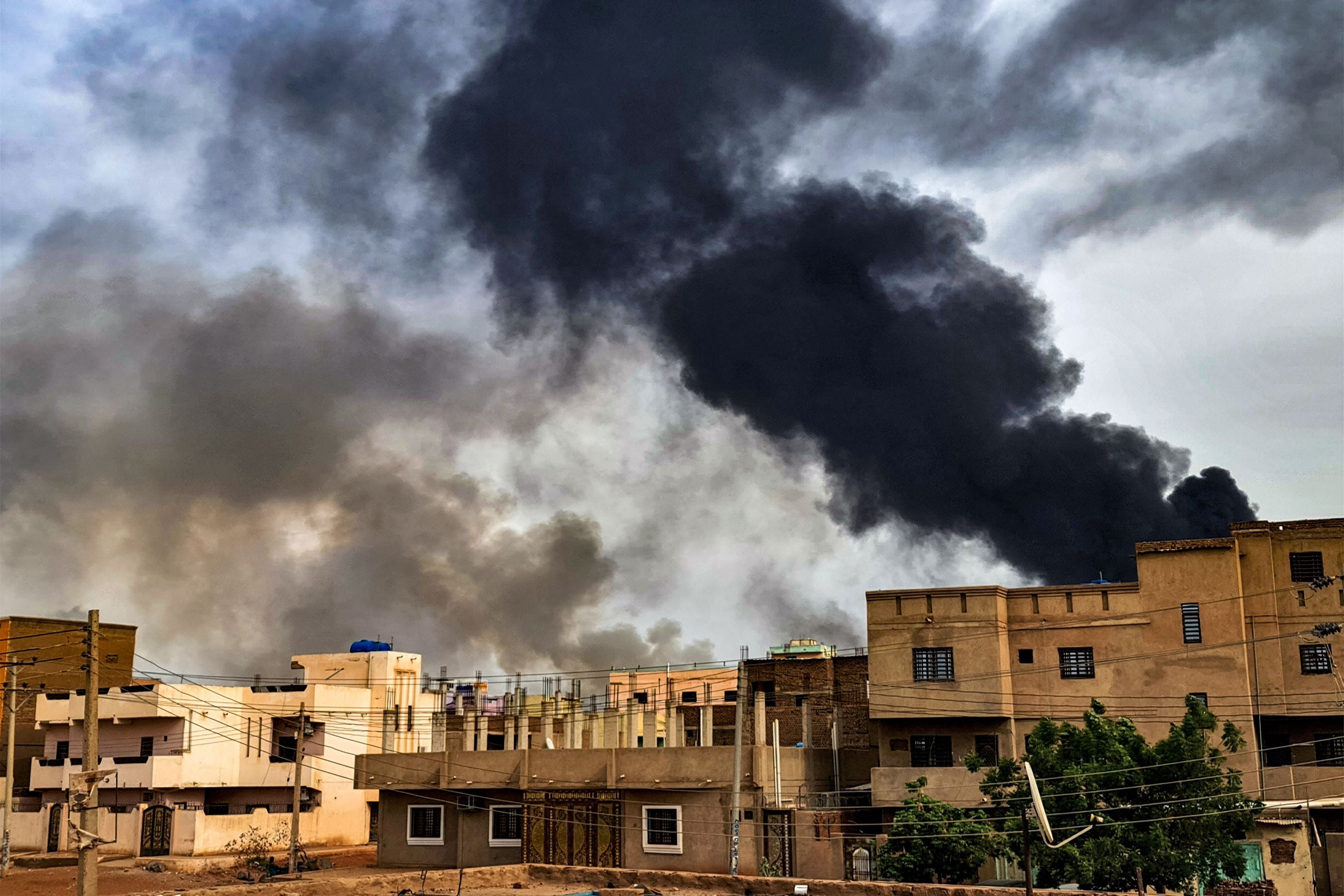 Smoke plumes billow from a fire at a lumber warehouse in Sudan’s capital, Khartoum, amid fighting on June 7, 2023. The fighting, eight weeks in at the time, have pitted Sudan's army chief Abdel Fattah al-Burhan against his former deputy Mohamed Hamdan Daglo who commands the Rapid Support Forces (RSF). 