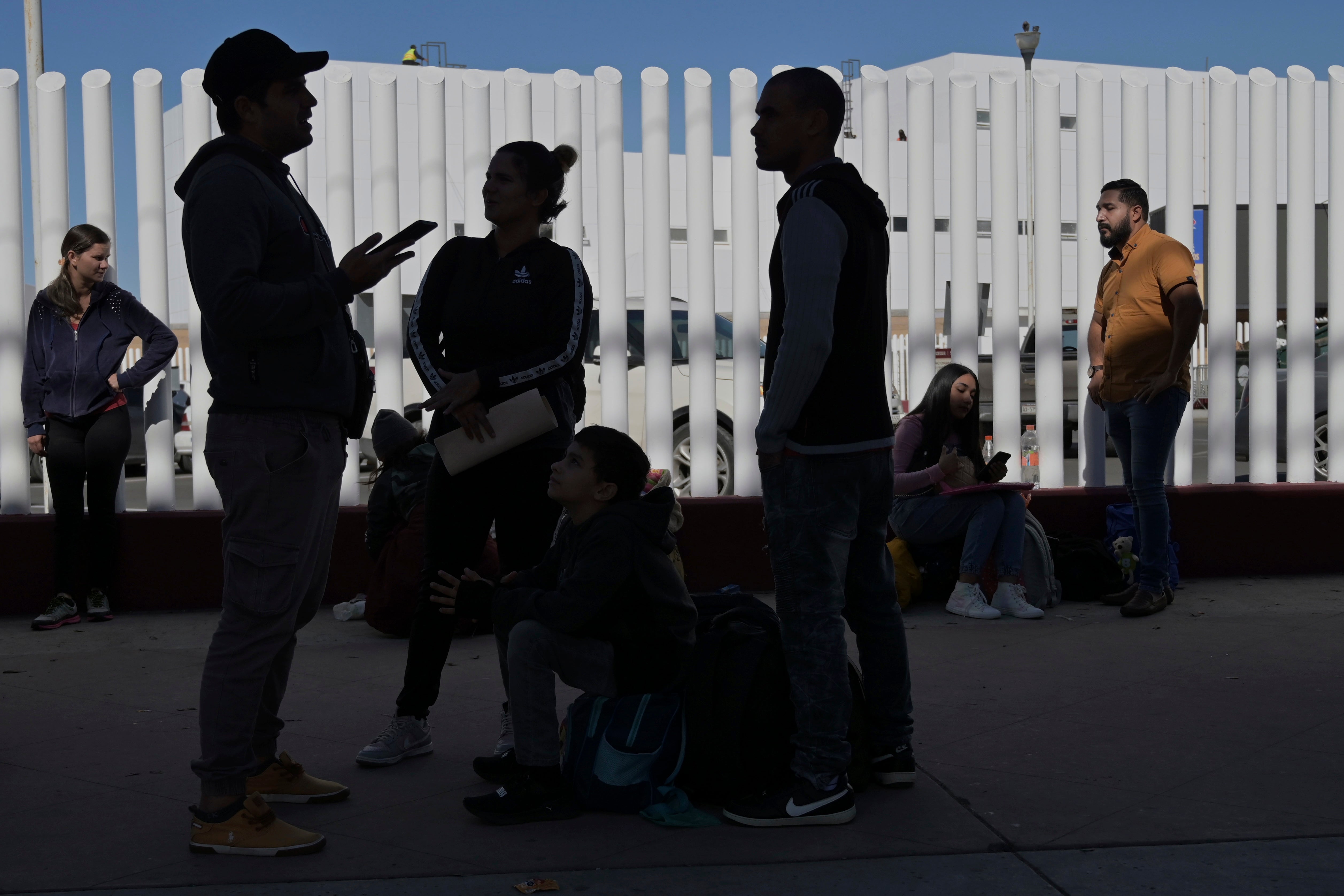 Asylum seekers wait at the US-Mexico border