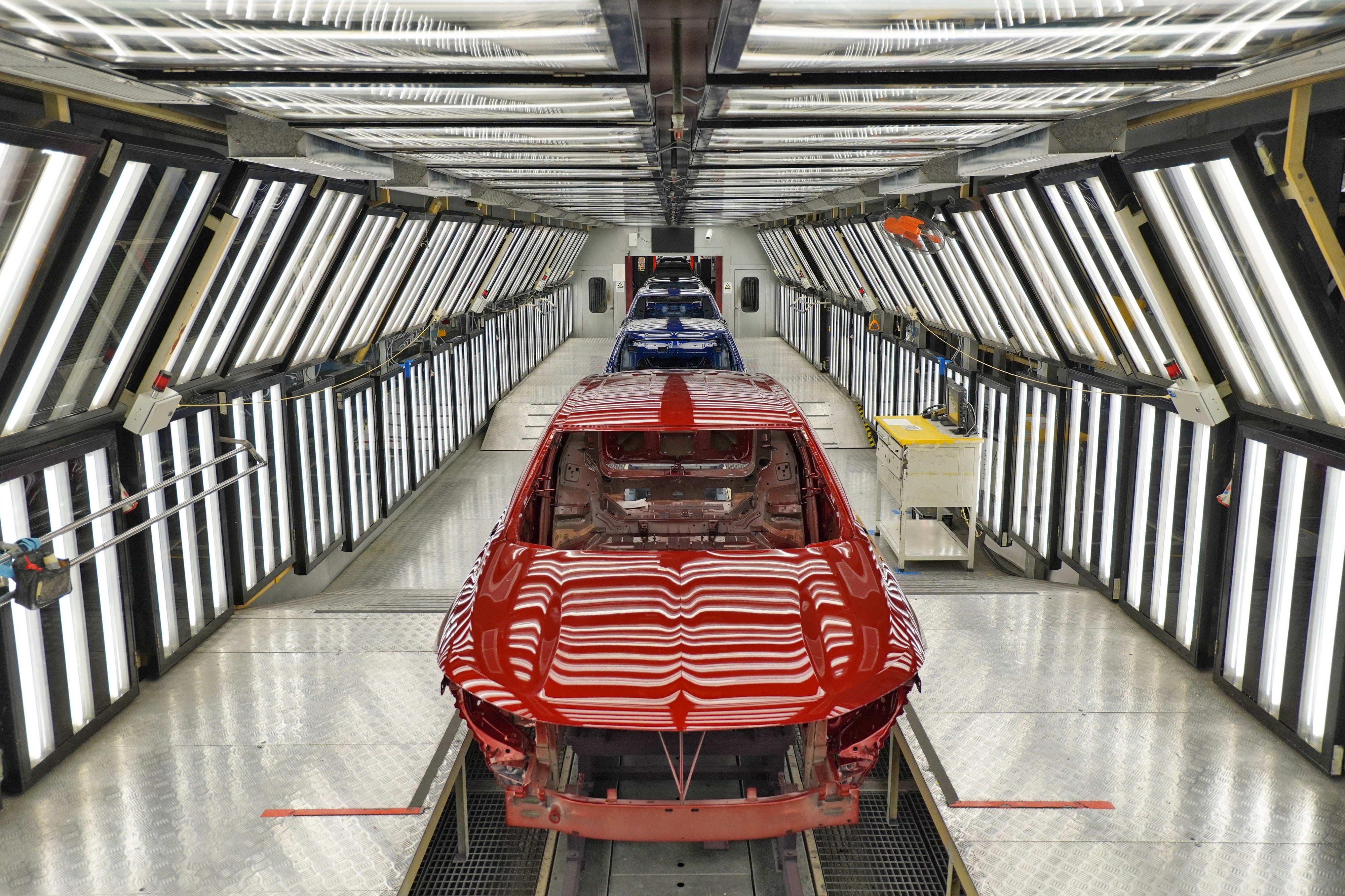 Cars are delivered on a production line