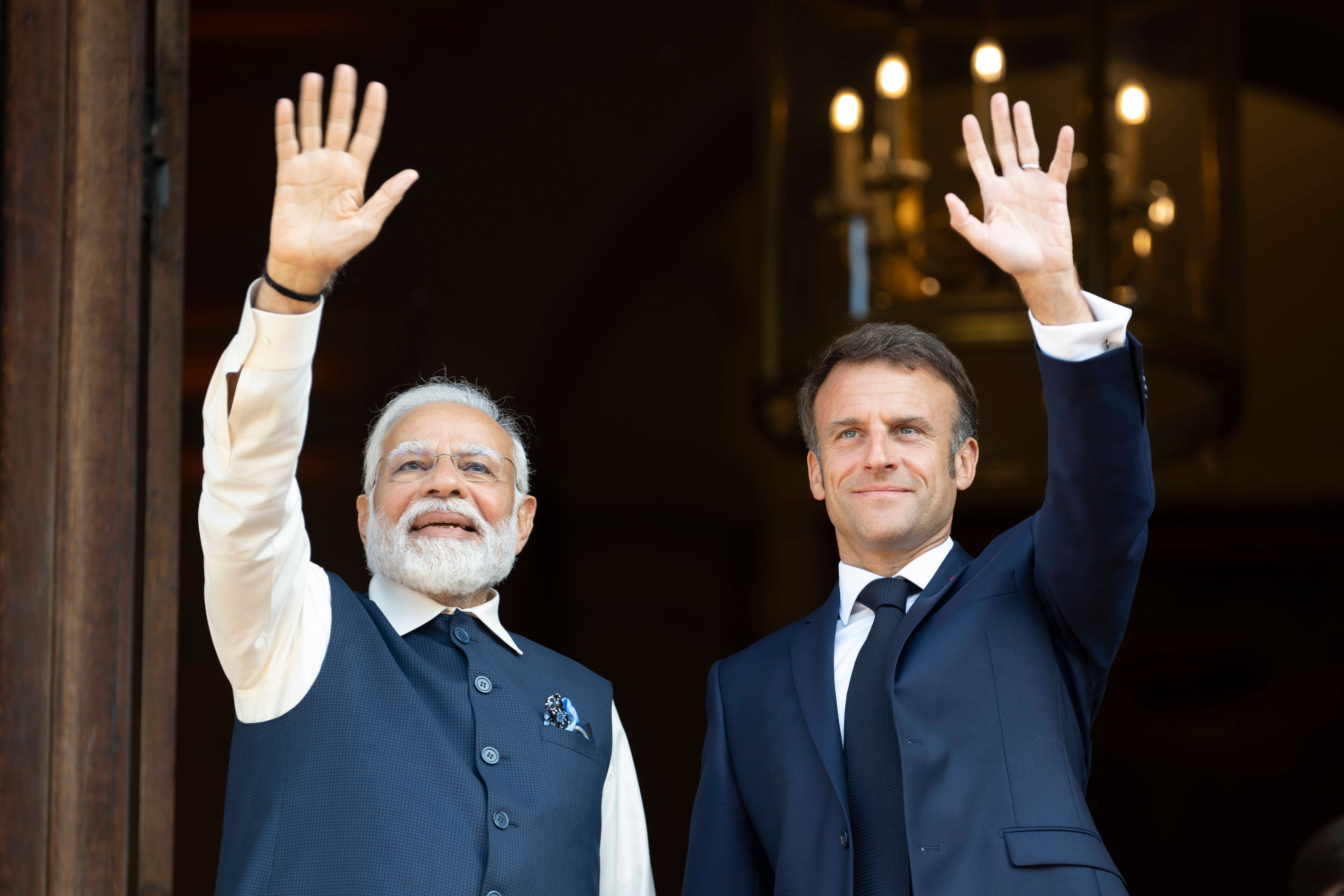 India's Prime Minister Narendra Modi (L) and France's President Emmanuel Macron attend a meeting at the Ministry of Foreign Affairs in Paris on July 14, 2023.