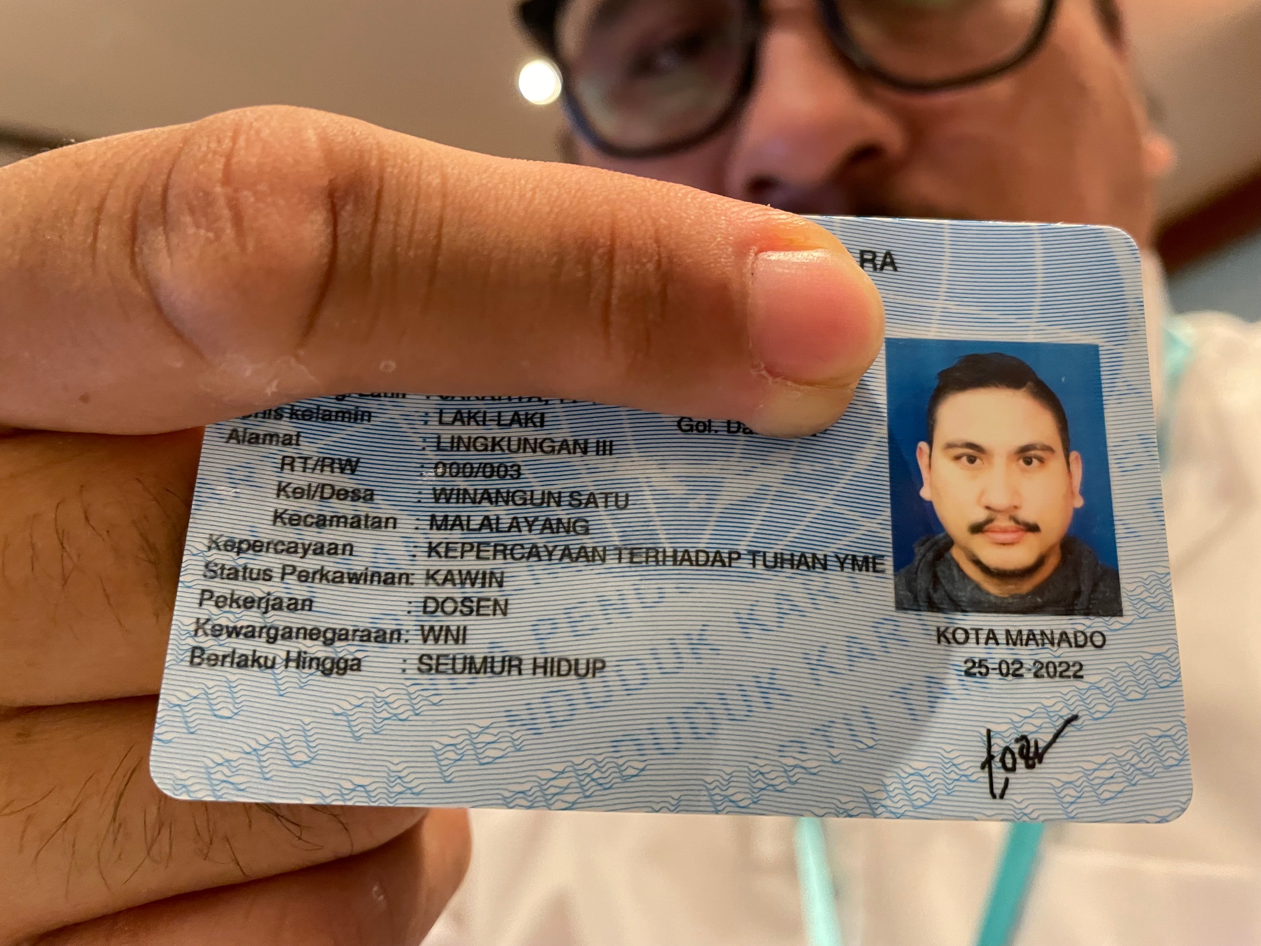In Indonesia, a believer in Judaism shows his new ID card with the religious column, "Belief in the one God."