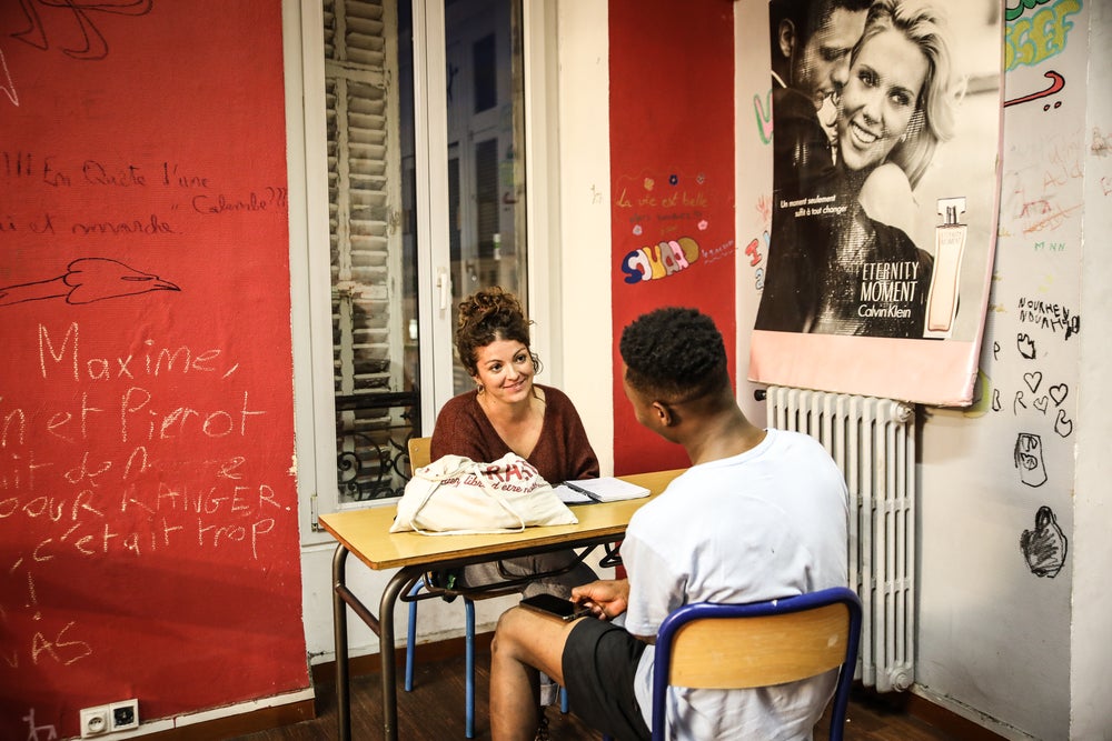 A nurse speaks to a young person