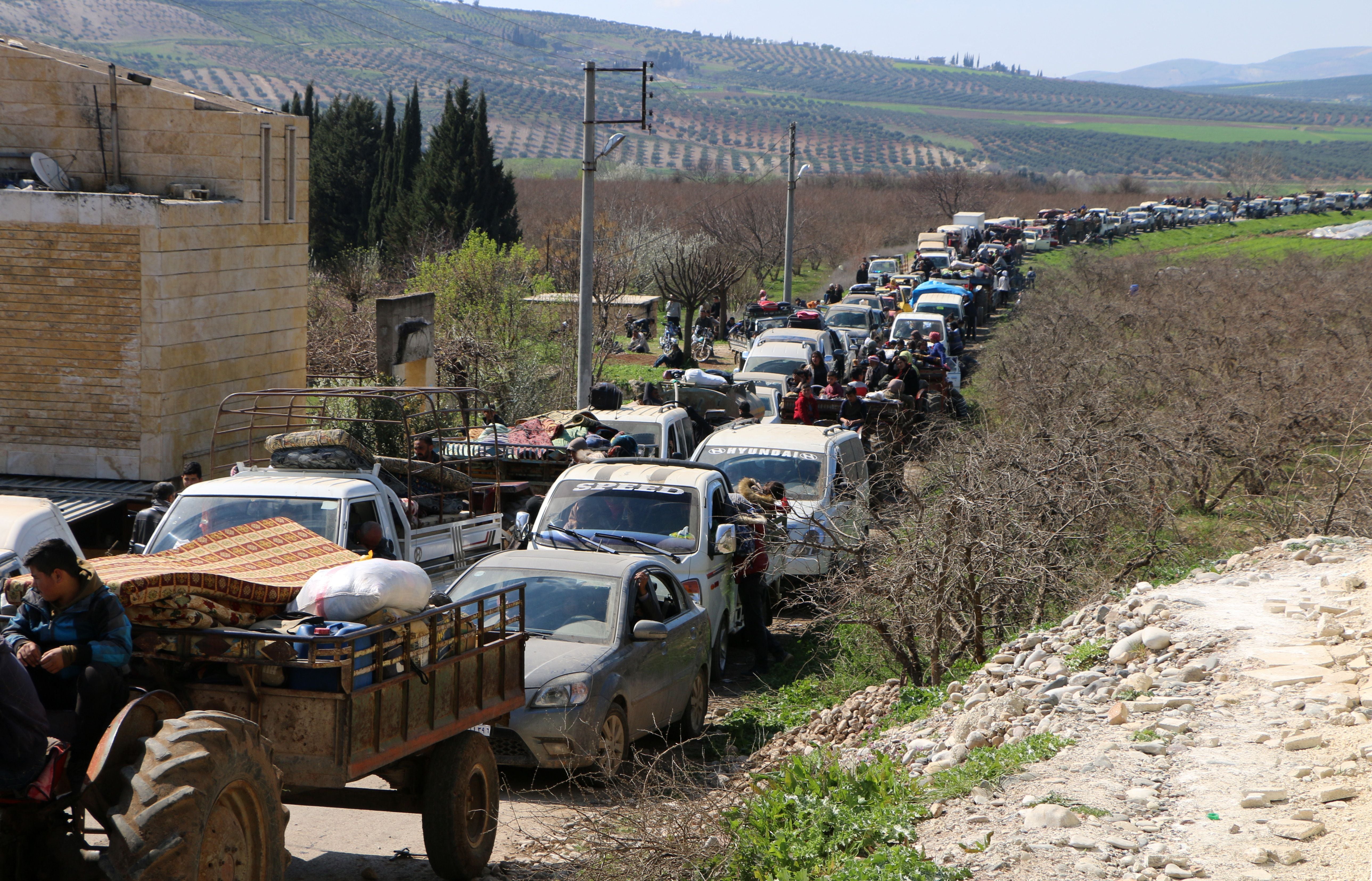 A line of cars on a rural road