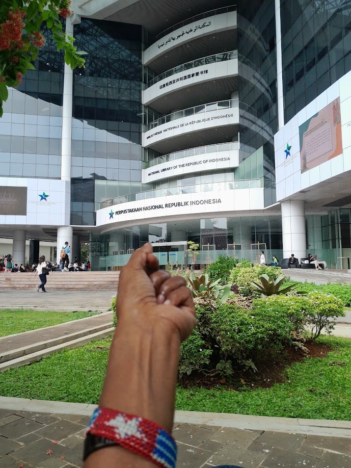 A Morning Star flag bracelet worn on a person's wrist