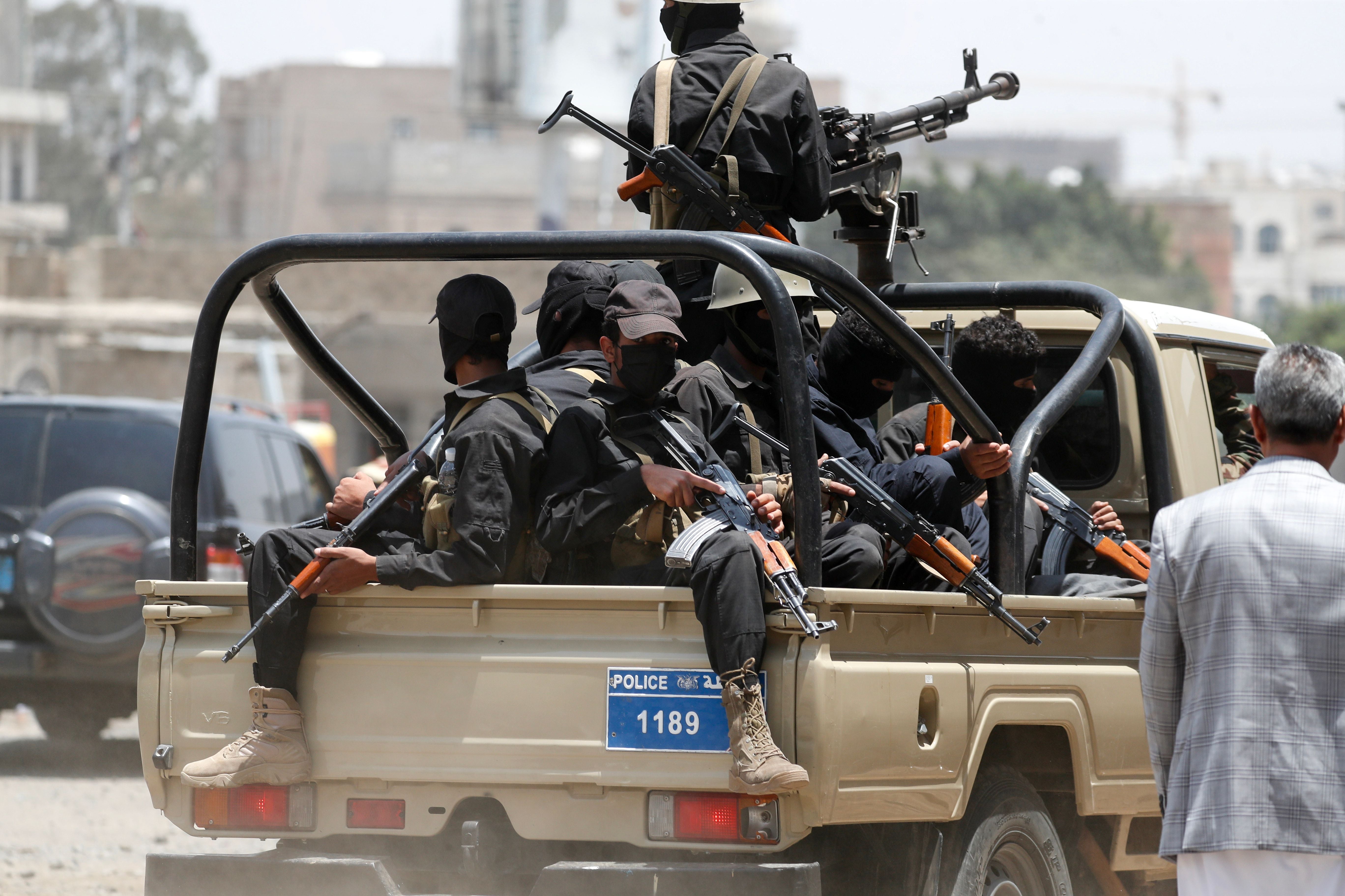 Yemeni soldiers loyal to the Houthis ride a truck as they patrol in Sanaa, Yemen, August 27, 2023. 