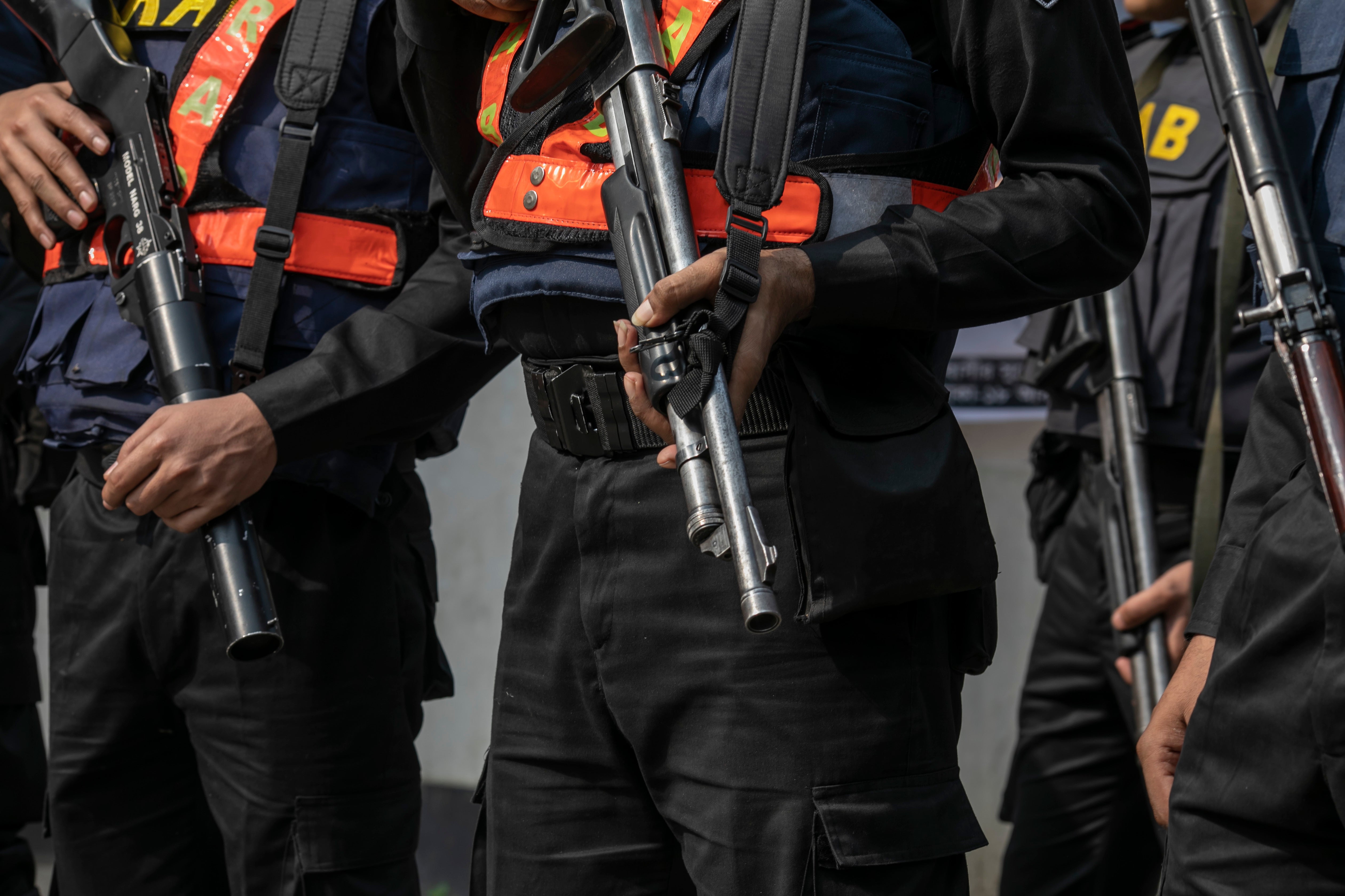 Members of Bangladesh’s paramilitary Rapid Action Battalion or RAB, a unit which is accused of enforced disappearances, stand guard in the capital Dhaka, January 7, 2024.