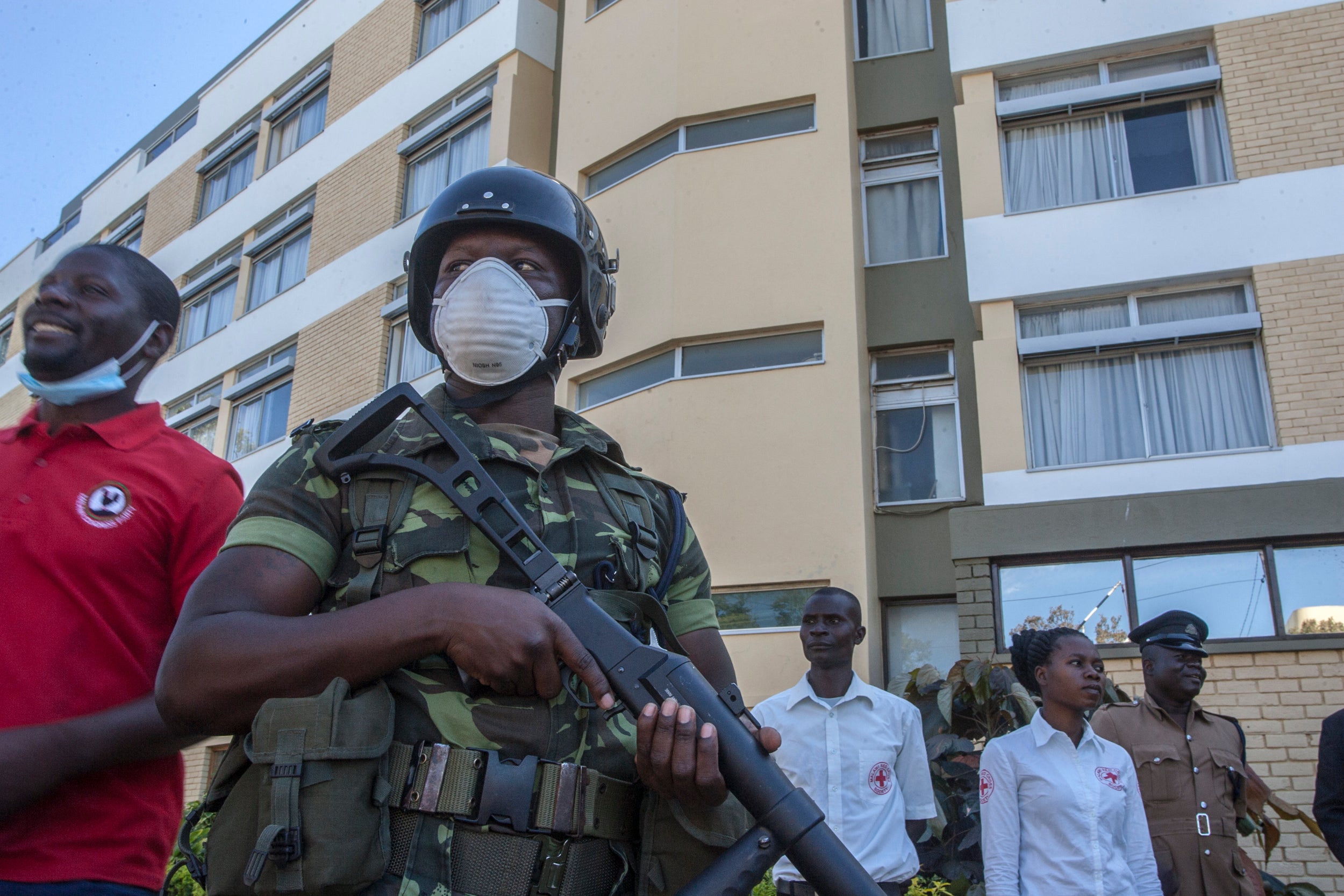 A policeman stands outside a hotel in Blantyre, Malawi, May 6, 2020.