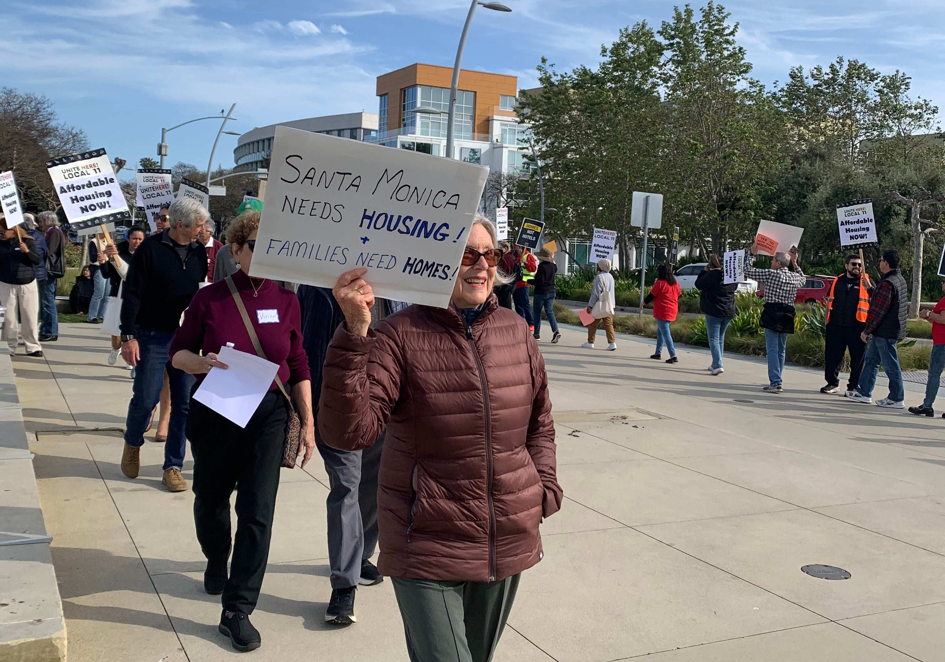 Santa Monica, California residents and workers gather at City Hall to demand affordable housing at the municipal airport site. 