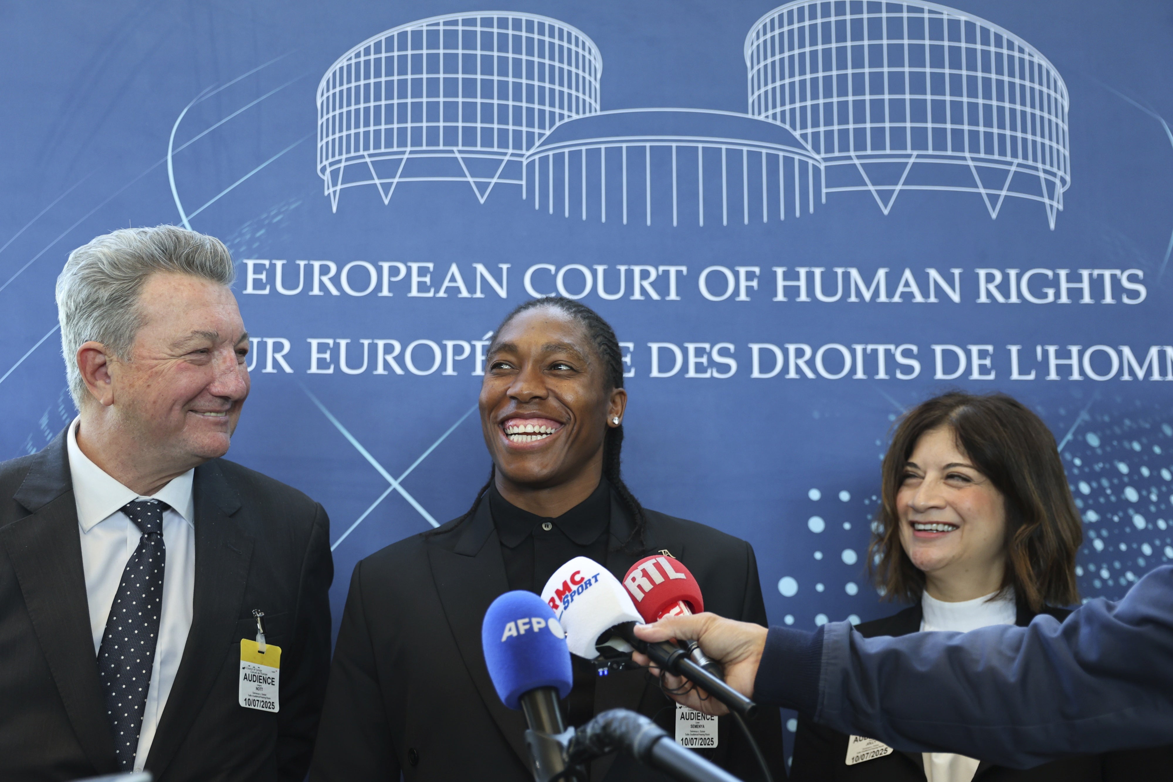 South Africa's Caster Semenya (C), answers reporters with lawyers Gregory Nott (L) , and Shona Jolly KC after Semenya won a partial victory at the European Court of Human Rights on in her seven-year legal fight against track and field's sex eligibility rules Strasbourg, eastern France, July 10, 2025.