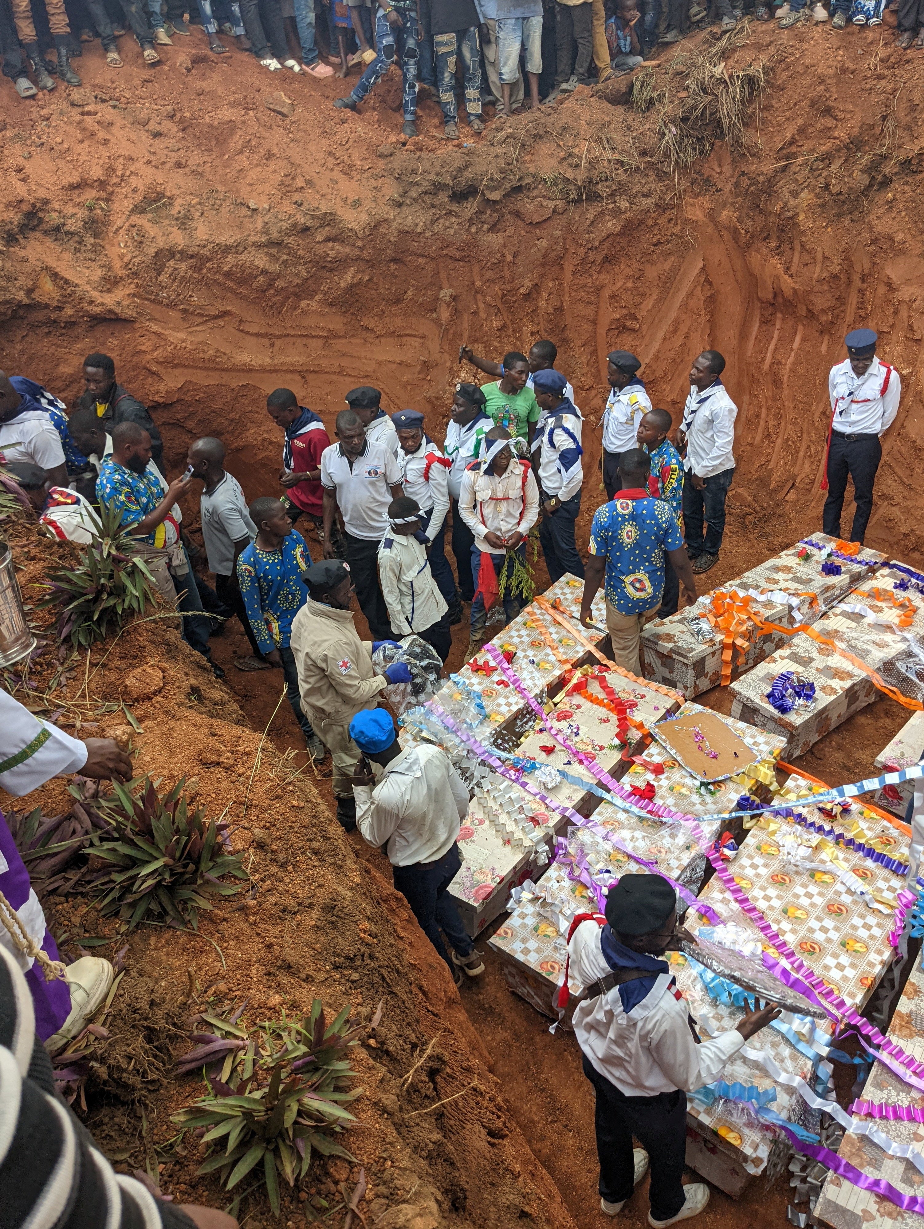 People gathered to bury those killed in an attack