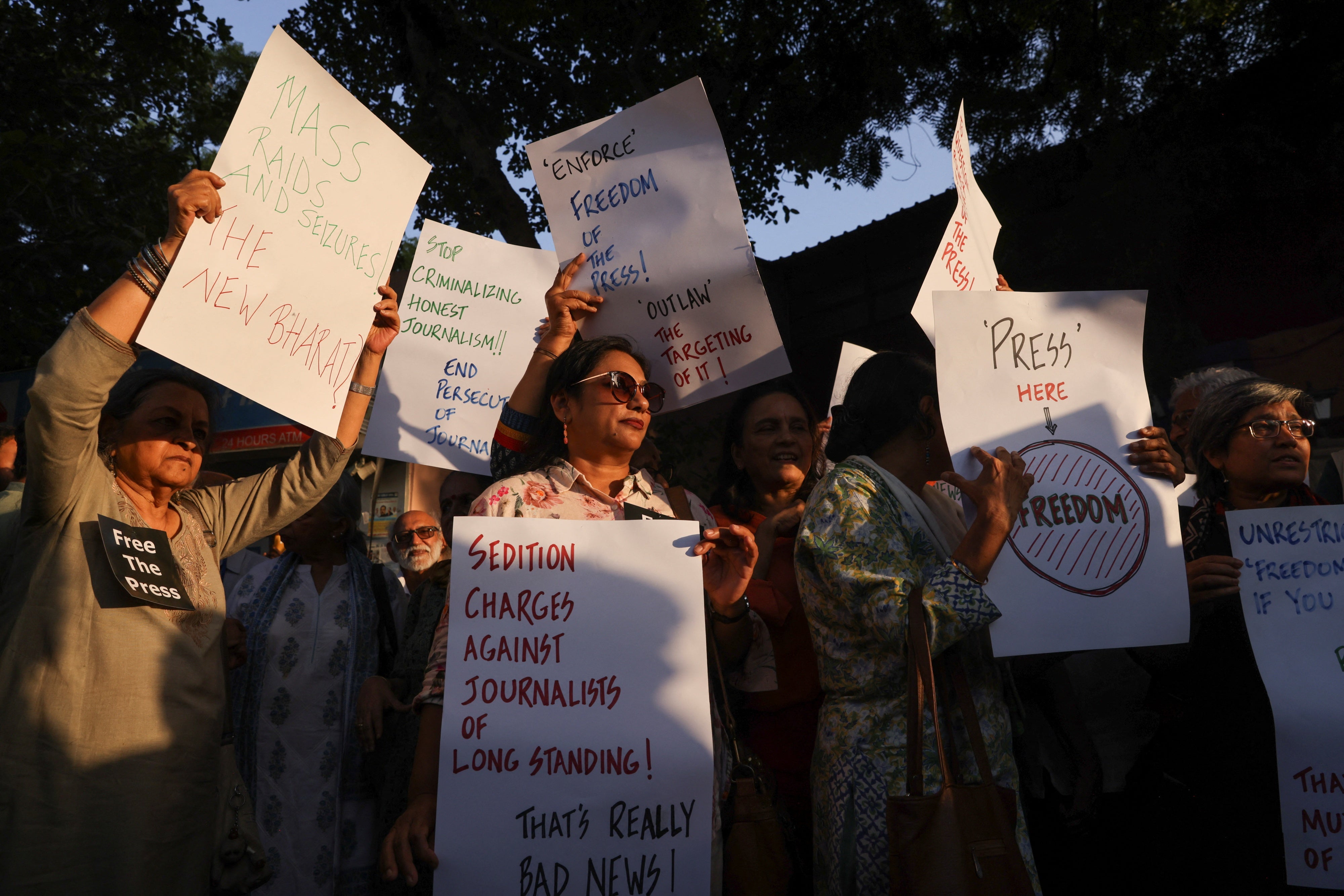 Members of the media protest a police raid on the office of a news portal and homes of journalists and writers linked to it, at the Press Club in New Delhi, India, October 4, 2023.