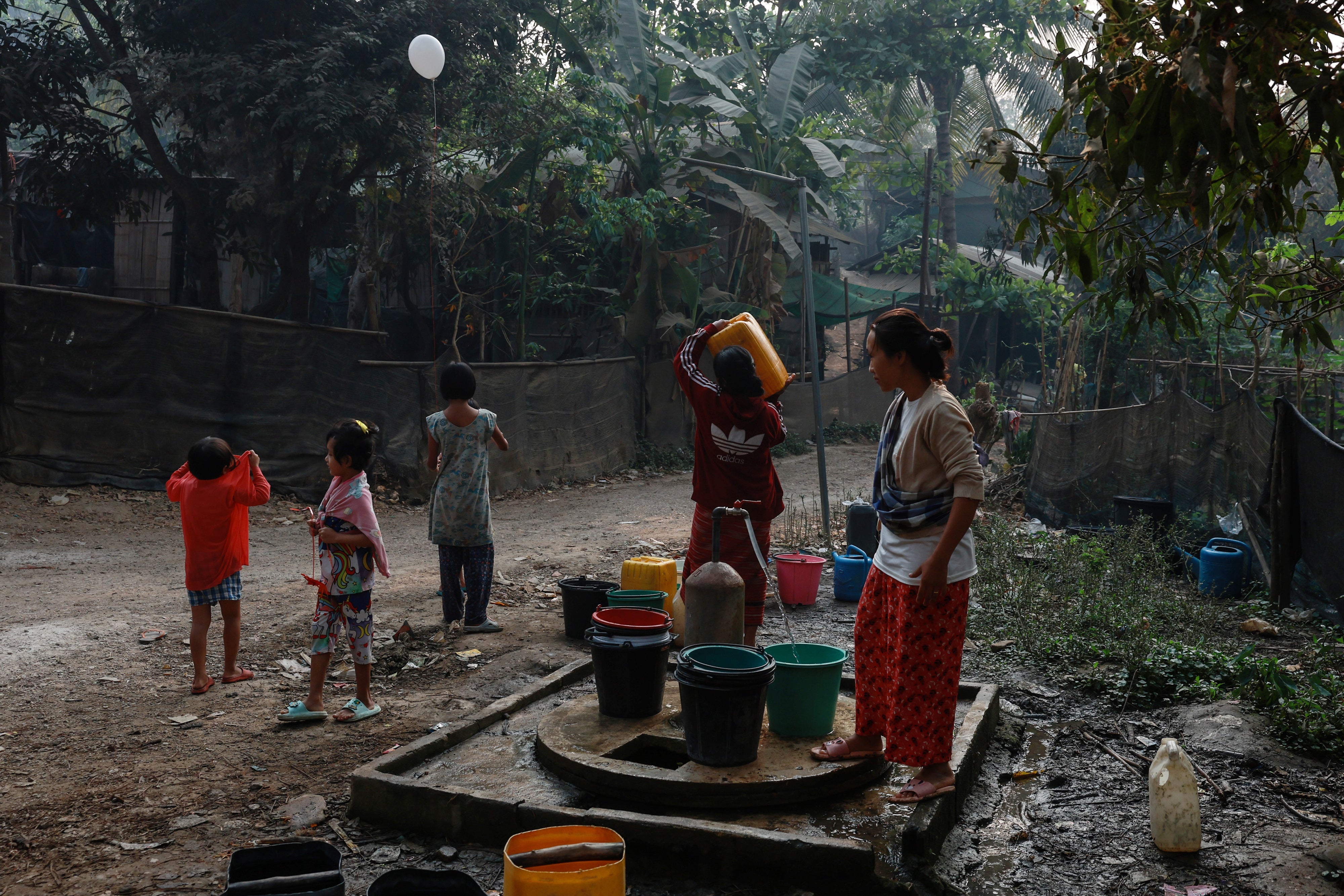 Refugees collect water at Mae La refugee camp in Thailand