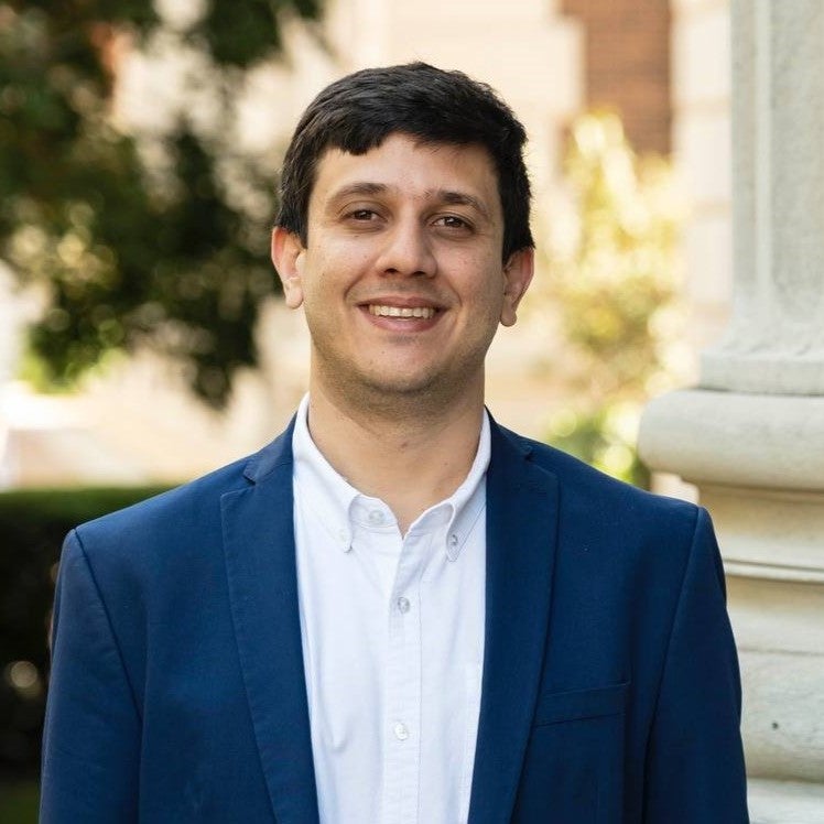 A man smiling in a photo