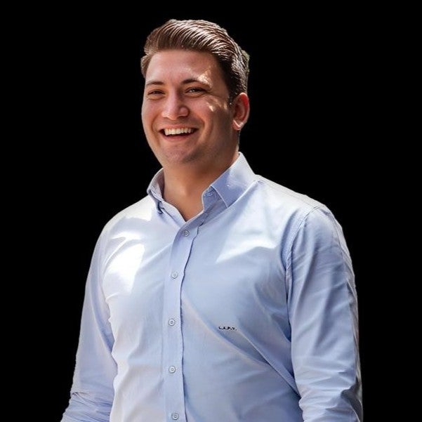 A man smiling in a photo