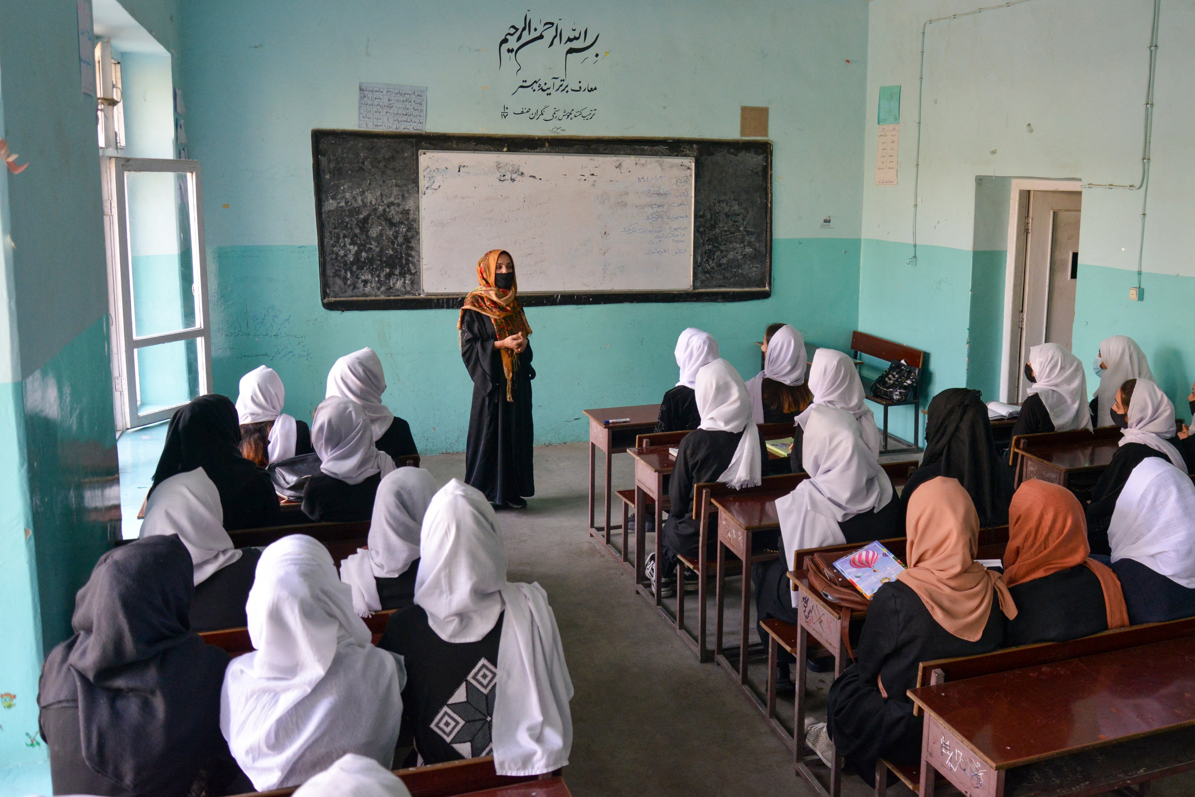 Afghan girls attend a class after their school reopened in Kabul on March 23, 2022. Hours later, the Taliban ordered girls' secondary schools shut.