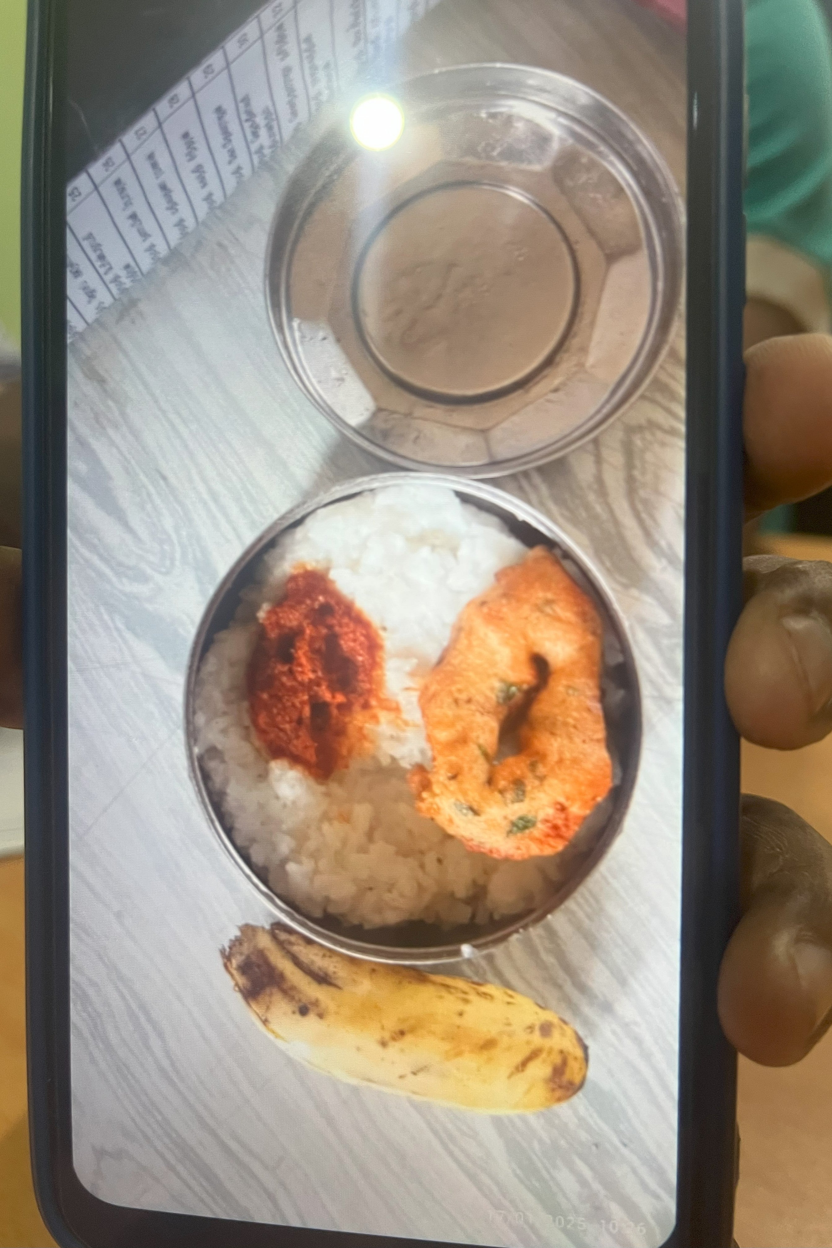Photo of a school lunch shown on a phone