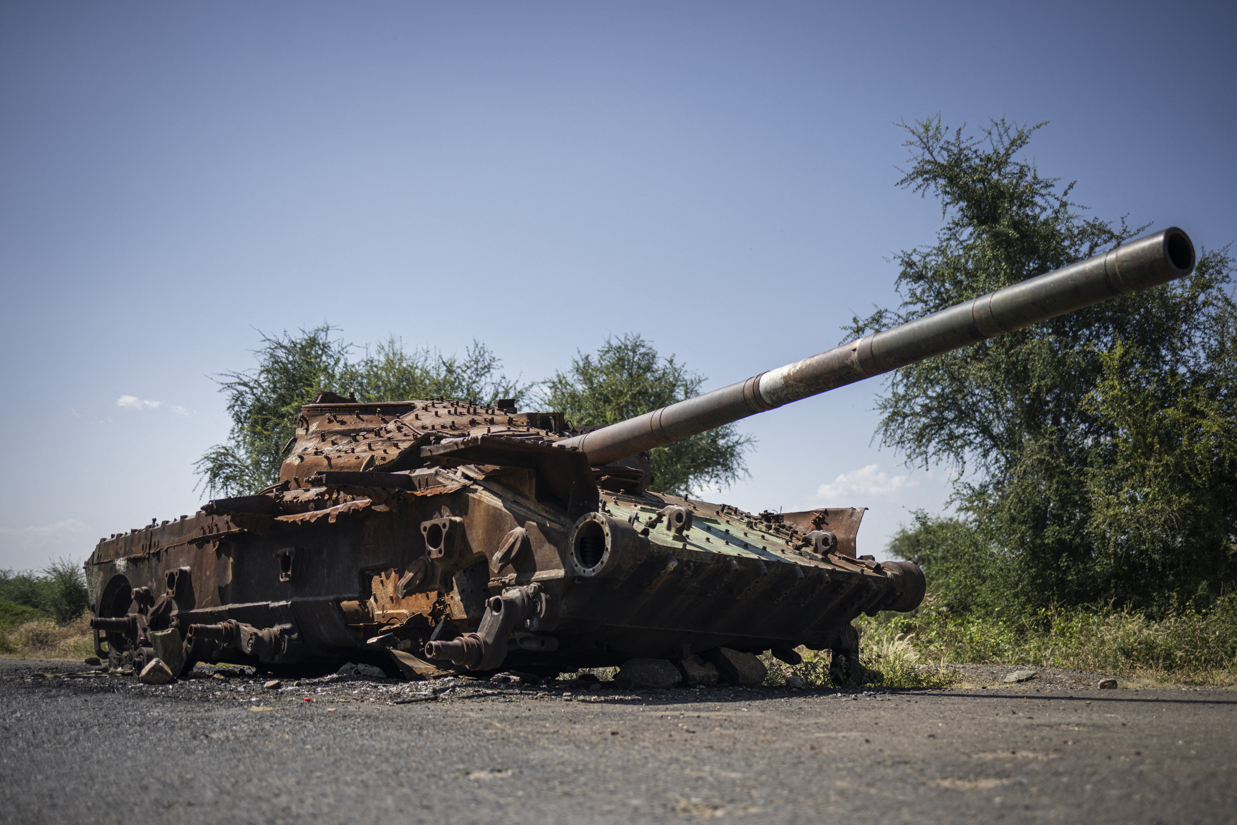 A charred T-72 tank lay on the road that connects Shiraro to Shire in Ethiopia's Tigray region, October 12, 2024. 