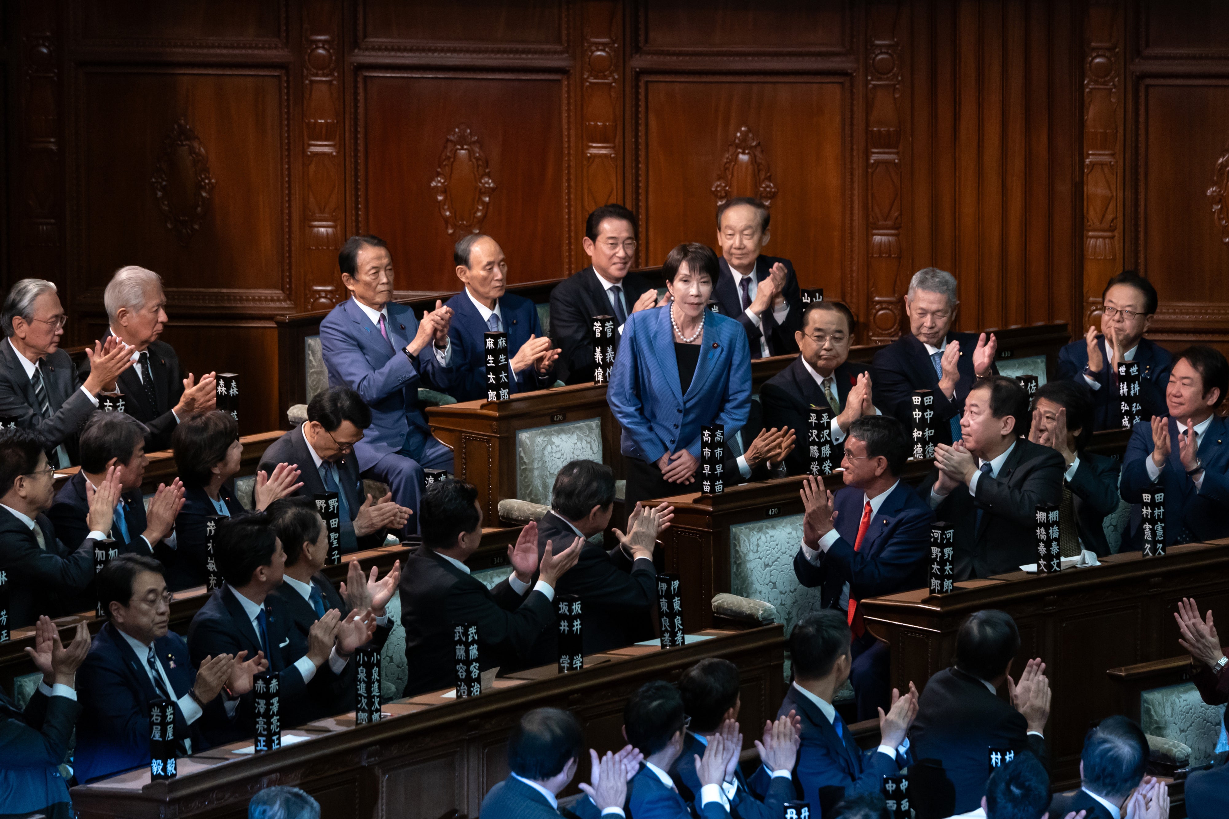 Sanae Takaichi is applauded after being elected Japan's new prime minister, October 21, 2025.