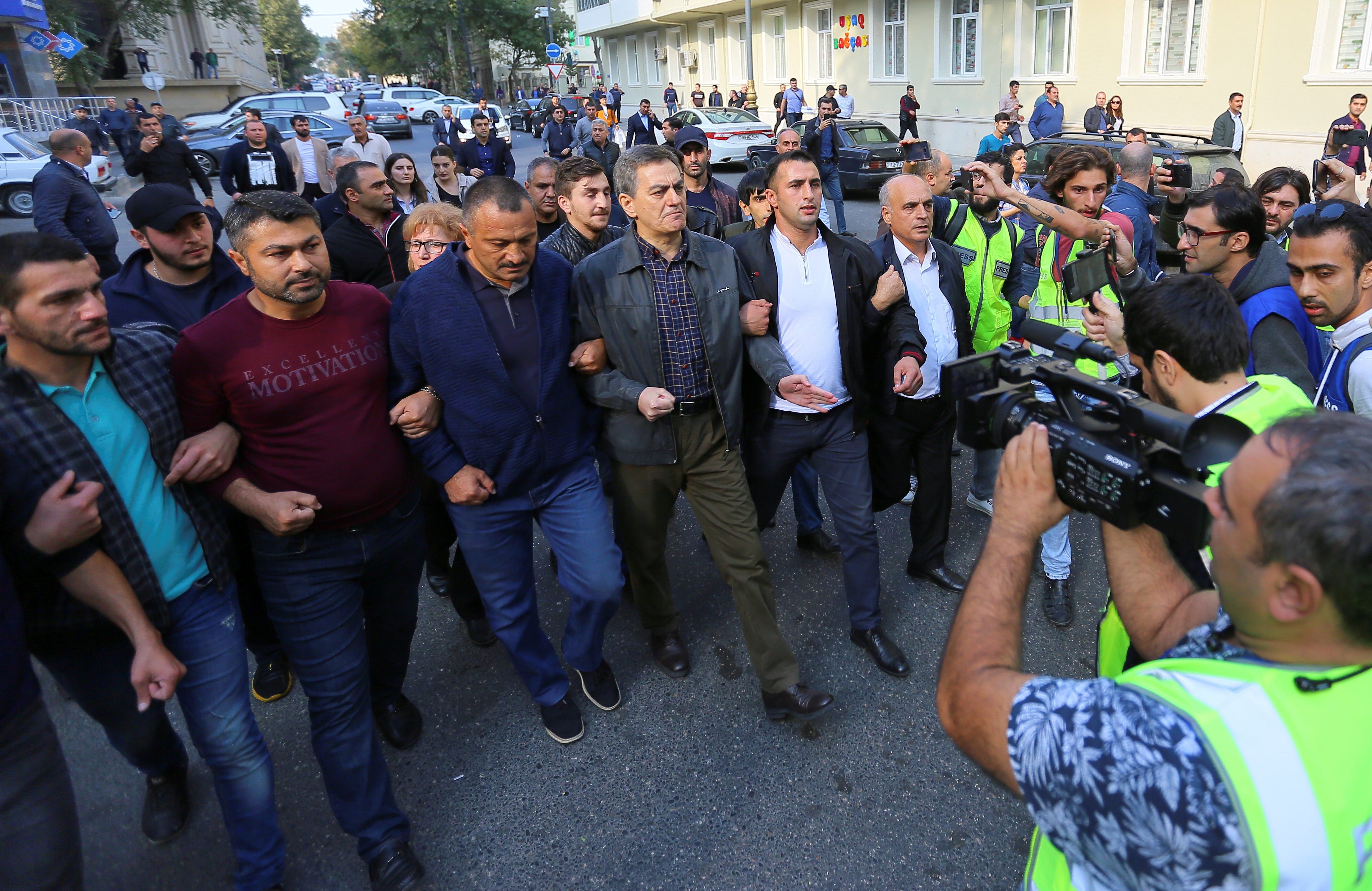 Head of the Popular Front Party of Azerbaijan Ali Karimli (C) and his supporters hold an unauthorized rally to demand the right to freedom of assembly, in Baku, Azerbaijan, October 19, 2019.