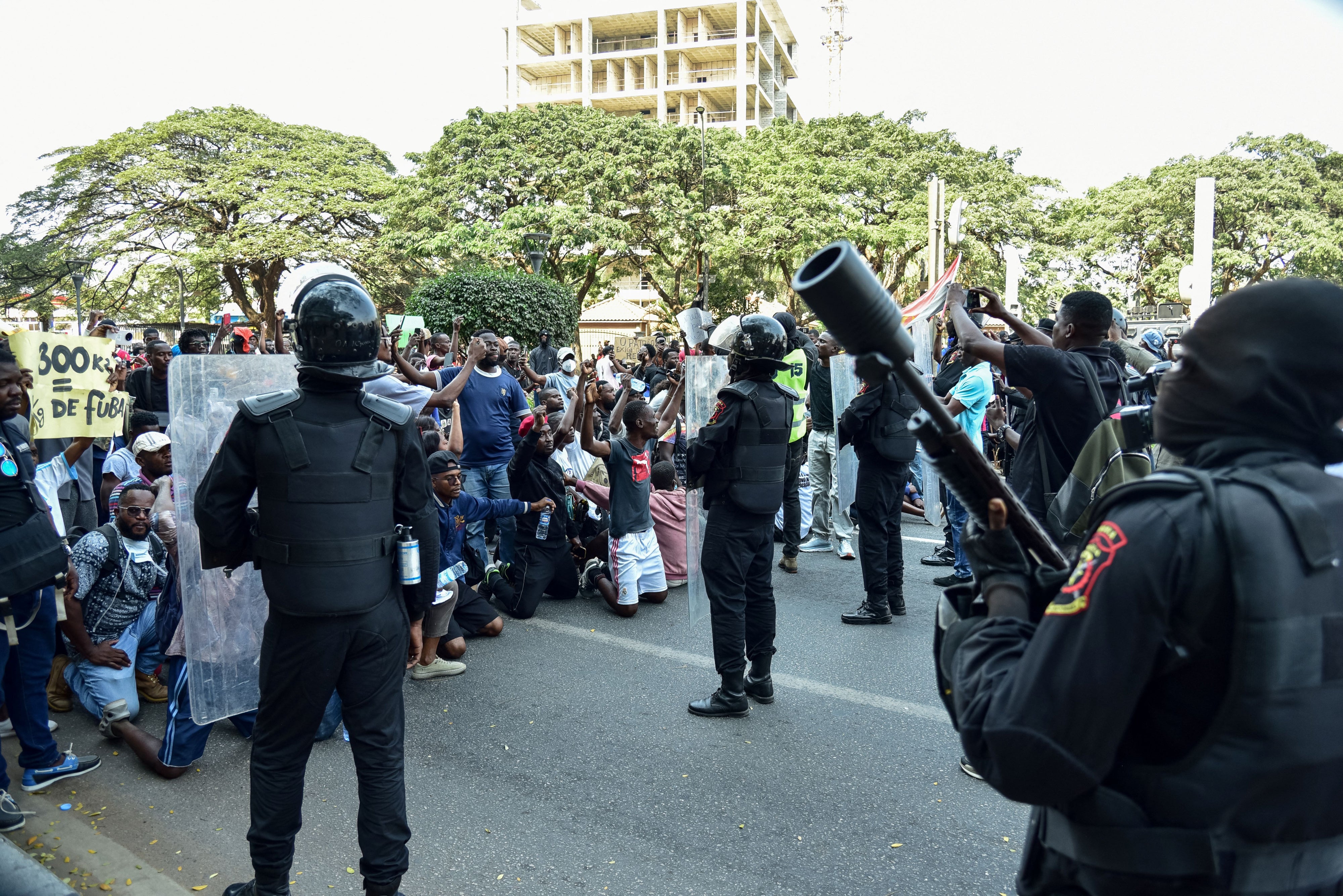 Angola's Rapid Intervention Force faces demonstrators during a protest 
