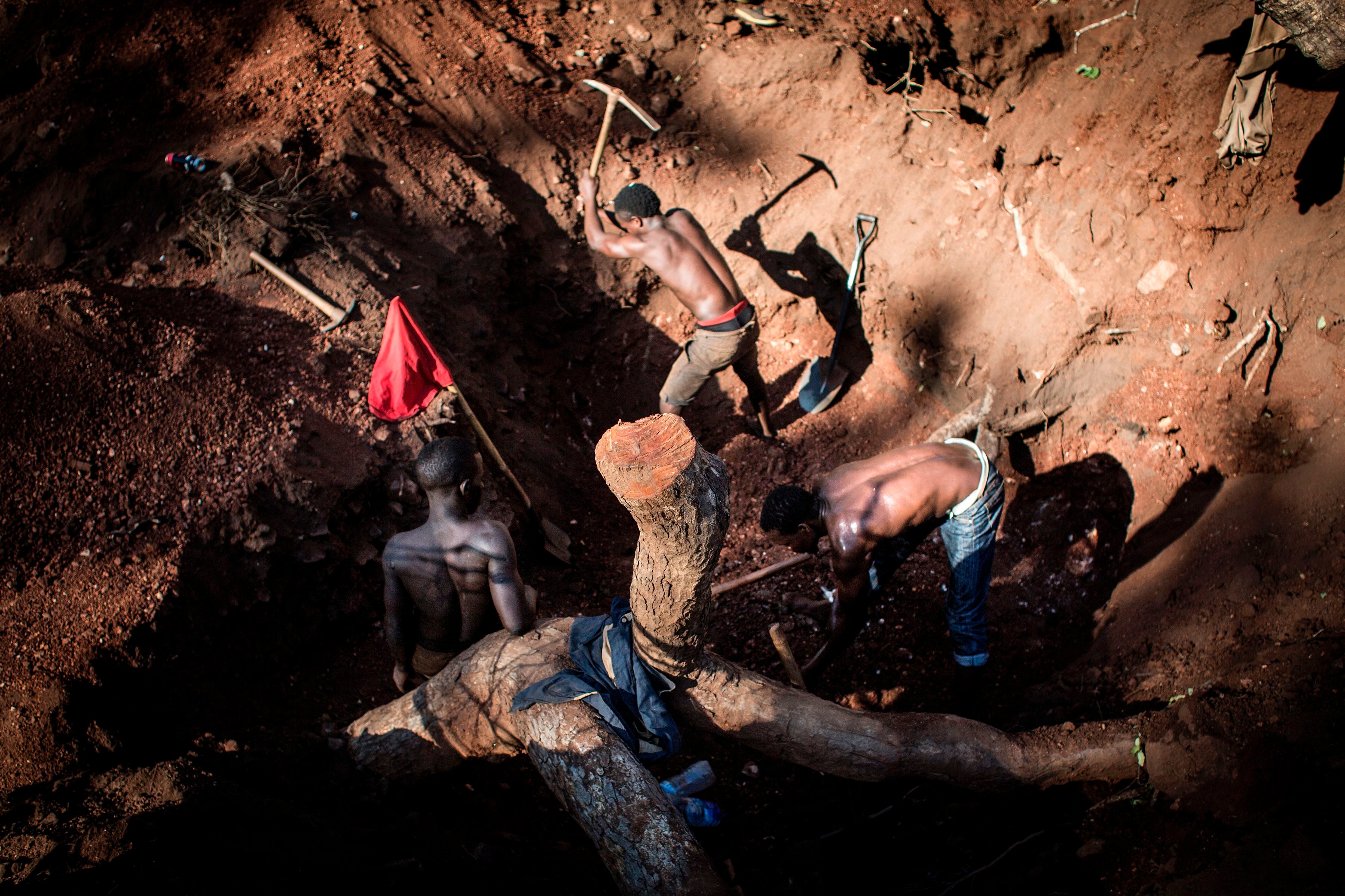 Artisanal miners excavate gold on the outskirts of Montepuez, Mozambique