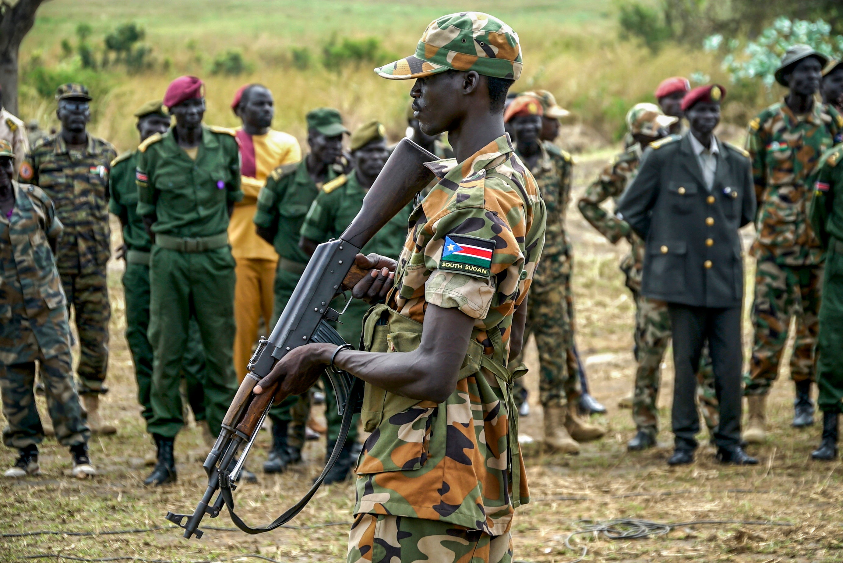 A South Sudanese soldier monitors the area as troops belonging to the South Sudanese Unified Forces take part in a deployment ceremony at the Luri Military Training Centre in Juba on November 15, 2023.