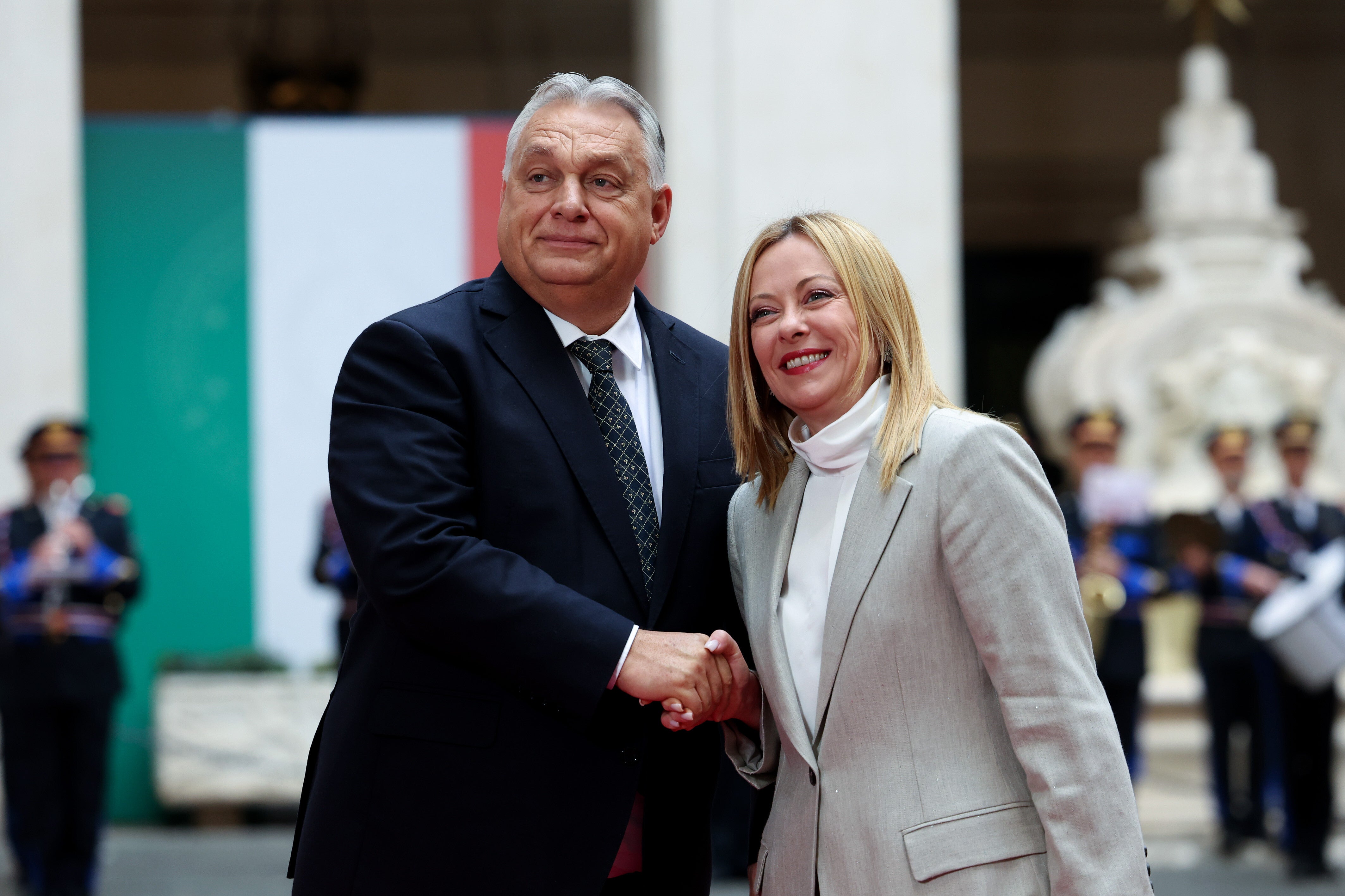 Italian Prime Minister Giorgia Meloni (R) welcomes Hungarian Prime Minister Viktor Orban in Rome, Italy, October 27, 2025.