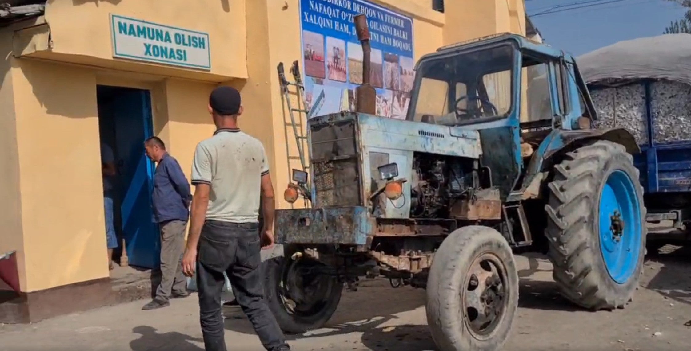 Farmers outside a cotton collection point