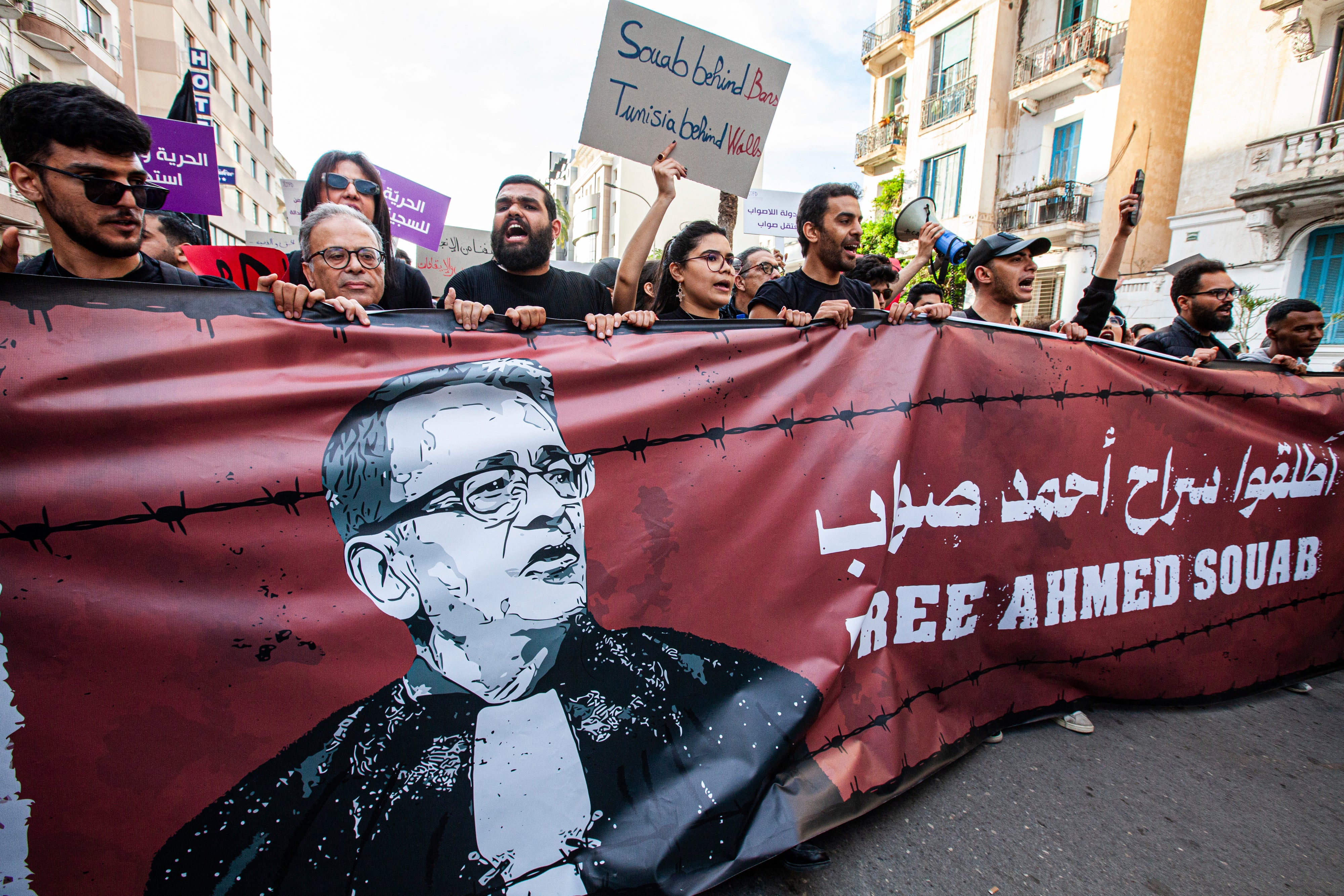 Supporters show support for the lawyer and human rights defender, Ahmed Souab, who was arrested on terrorism-related charges, in Tunis, Tunisia, April 25, 2025.