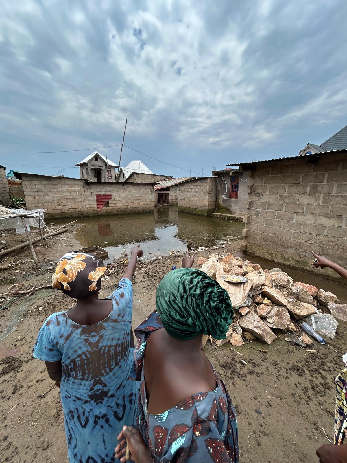 Women point to where the body of a loved one was found after he had been shot by M23 fighters, Uvira, South Kivu province, DR Congo, March 16, 2026. 