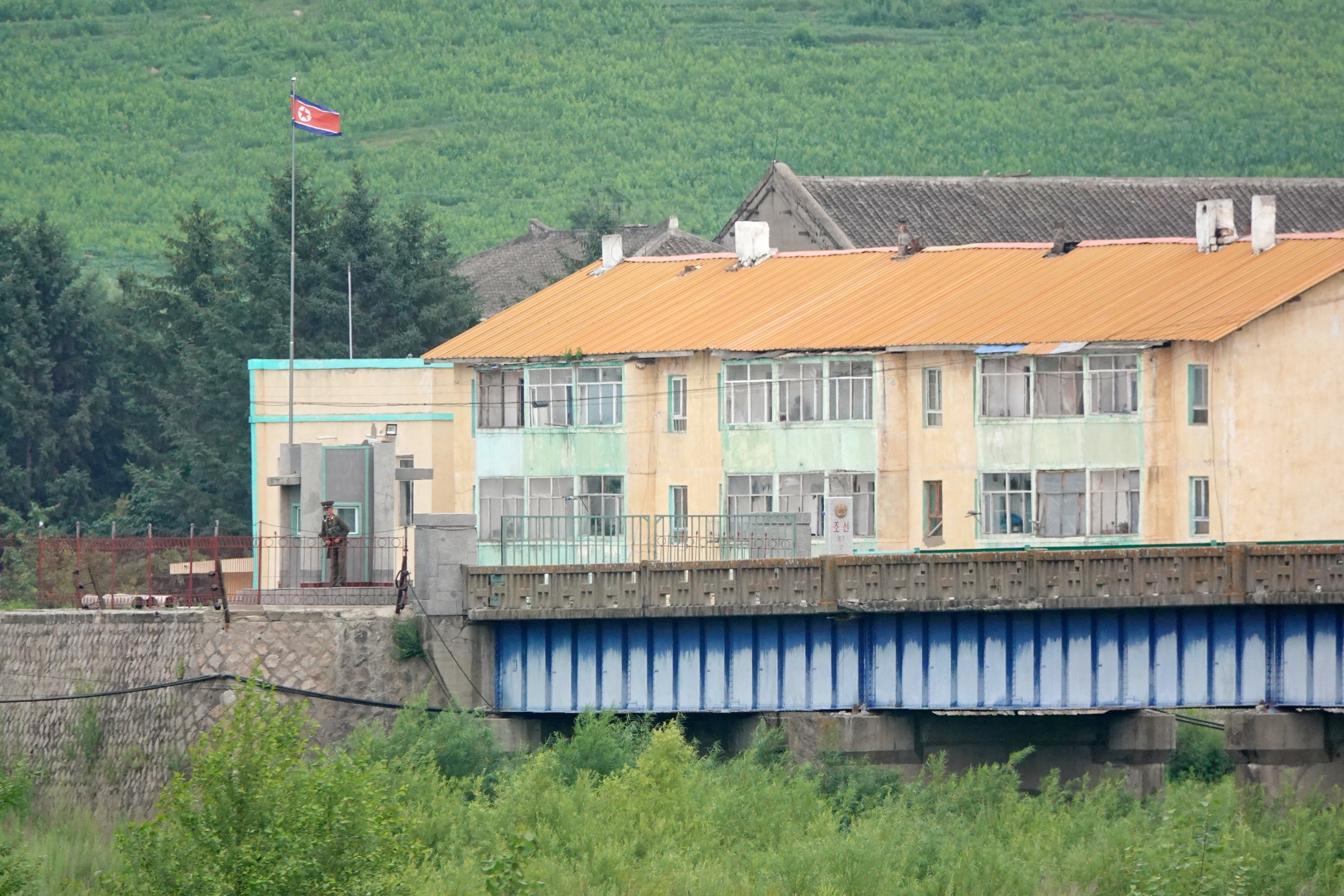 North Korean soldiers guard the bridge at the China-North Korea border in Tumen, Jilin province, July 14, 2024.