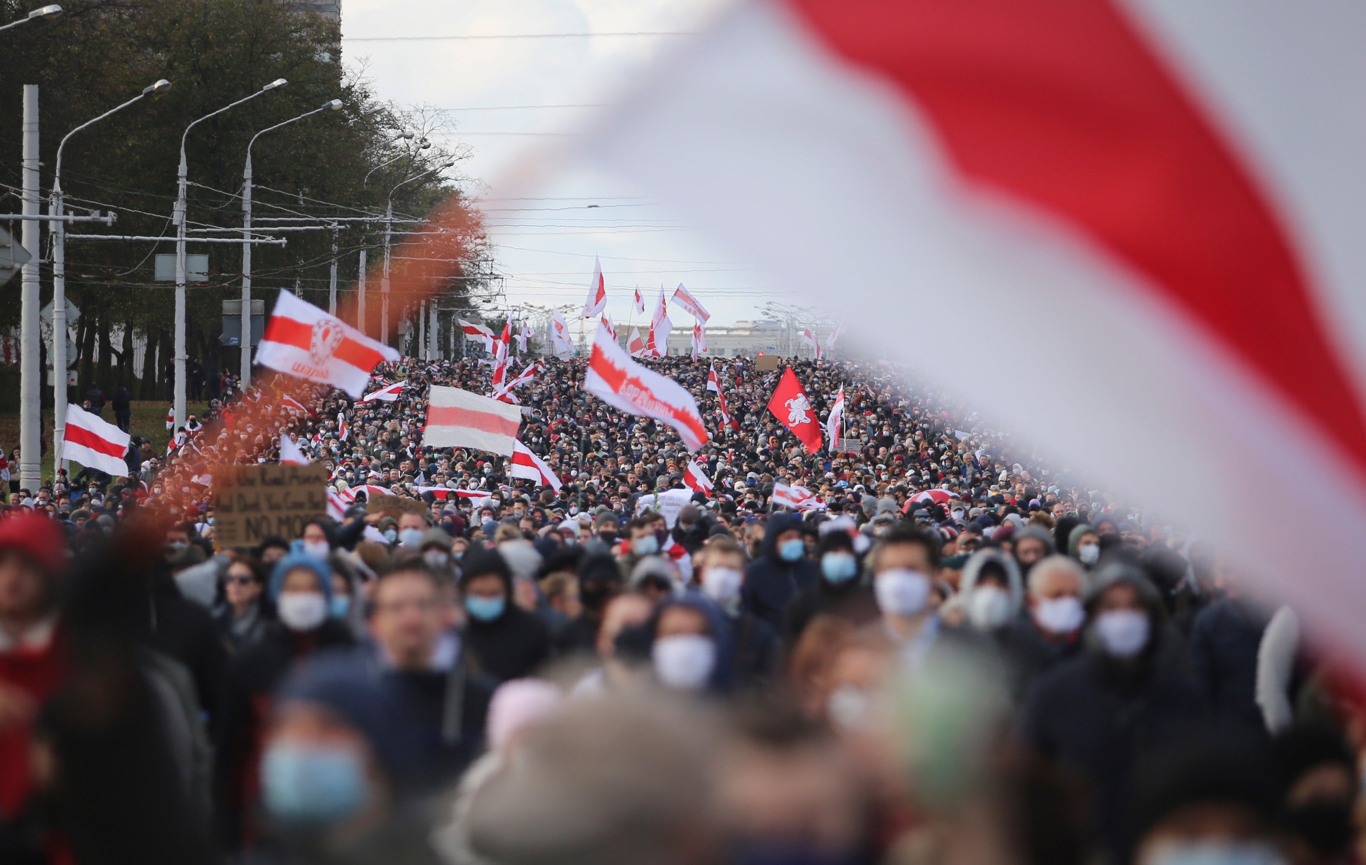 People march in an opposition rally to protest the presidential election results in Minsk, Belarus, October 18, 2020.