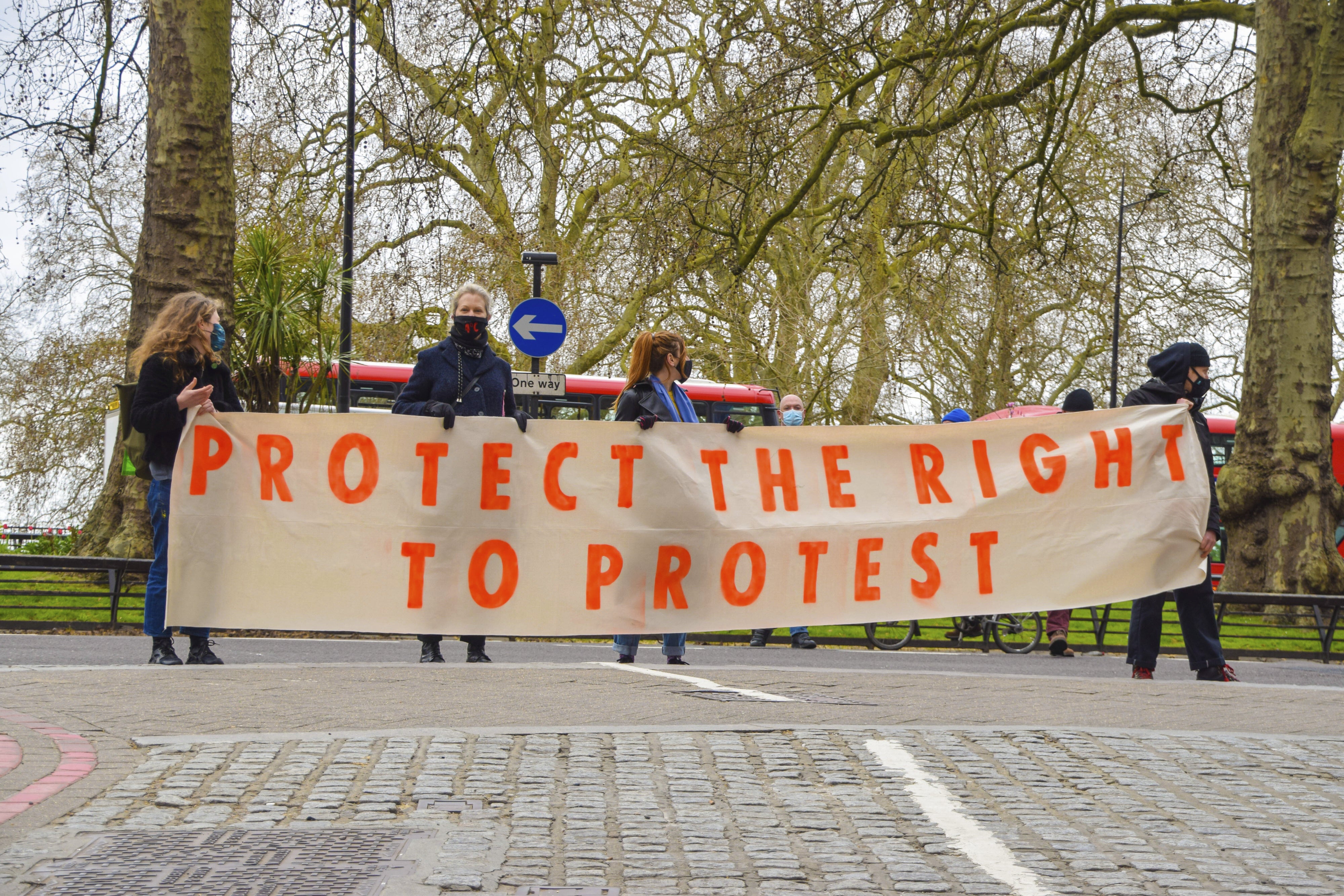 People rally to protect the right to protest in Central London, UK,  April 3, 2021.