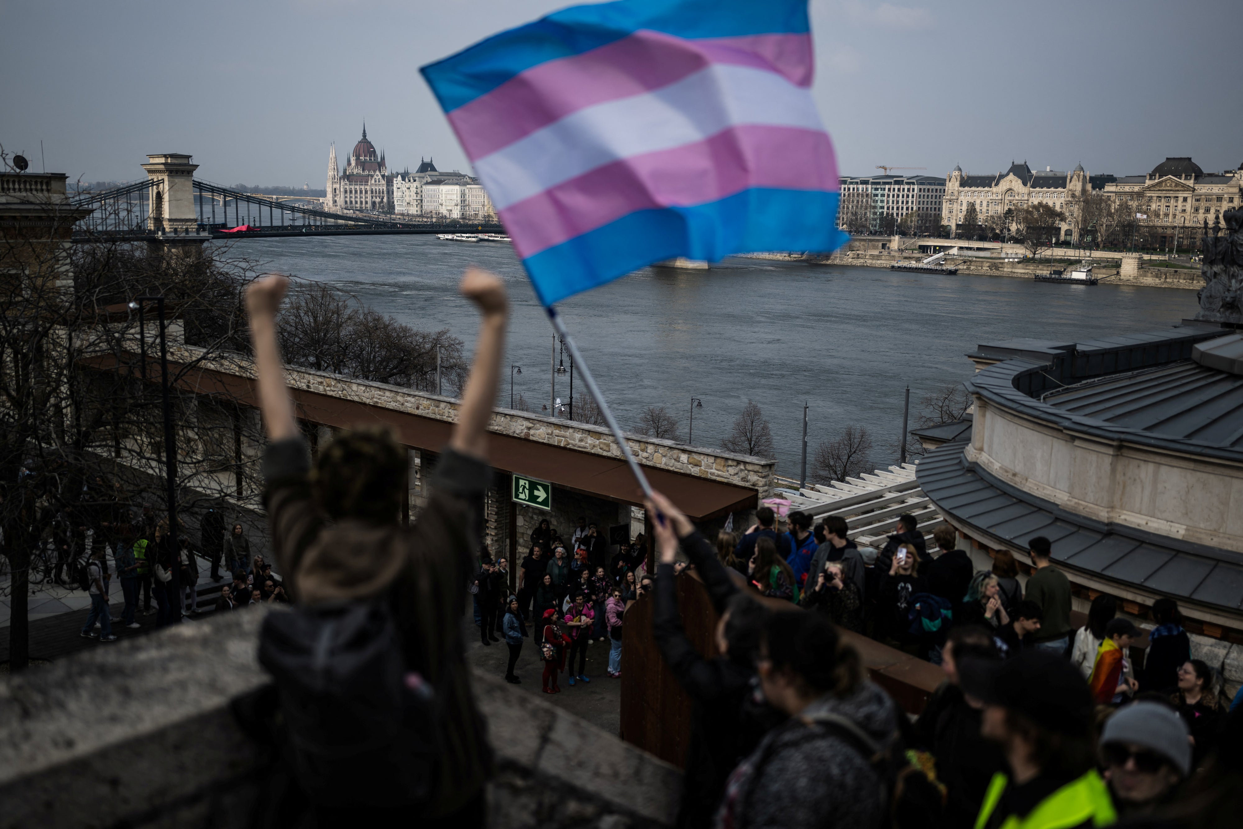 A transgender rights flag is held during a march after the Hungarian parliament passed a law that bans LGBT-related events, Budapest, Hungary, March 30, 2025. 