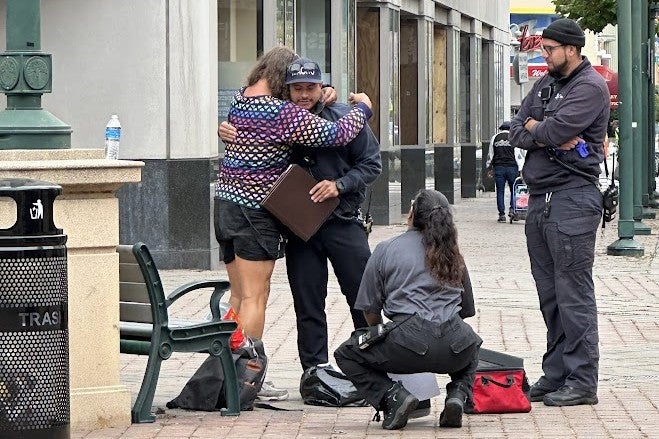 crisis intervention specialist supports a community member in distress