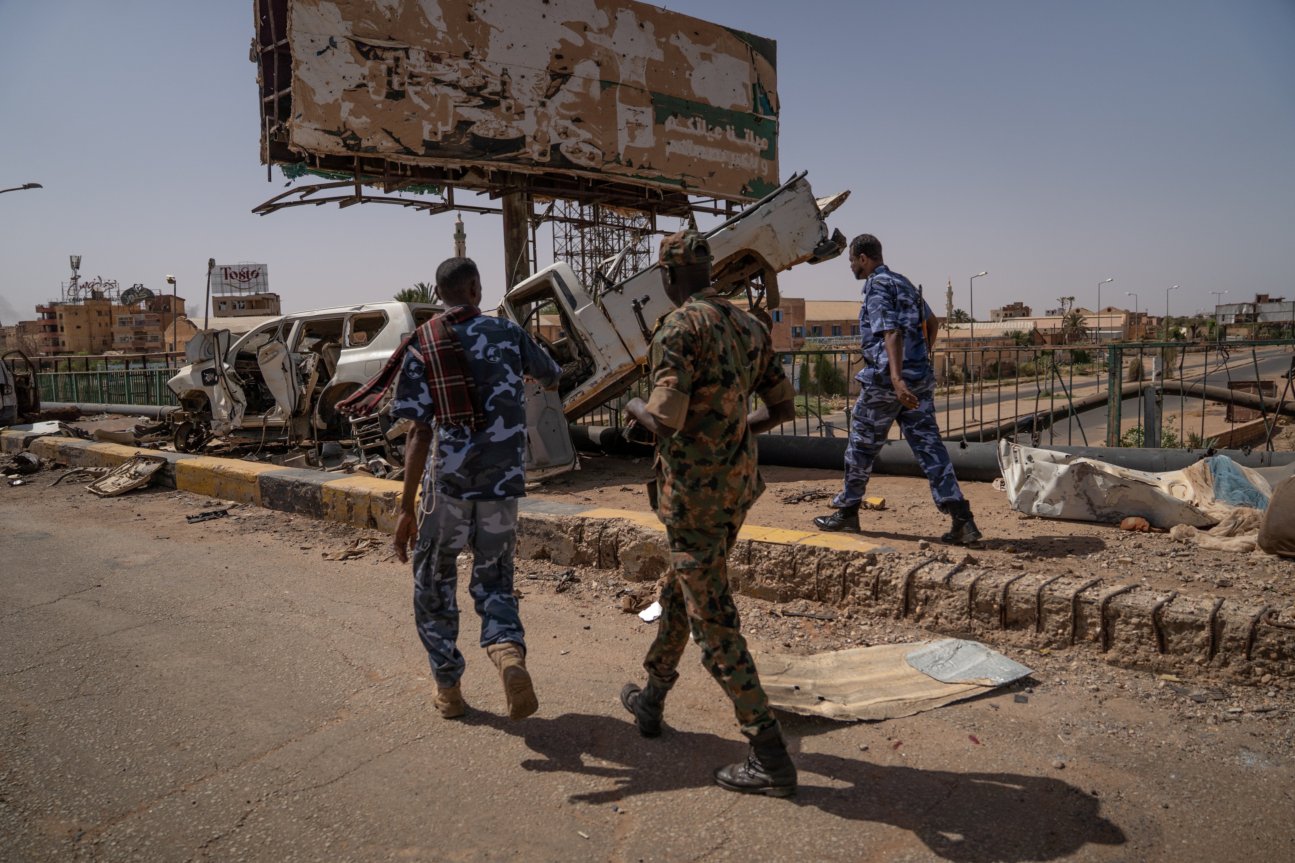 Soldiers of the Sudanese Armed Forces walk on the Shambat Bridge in Khartoum, April 27, 2025.