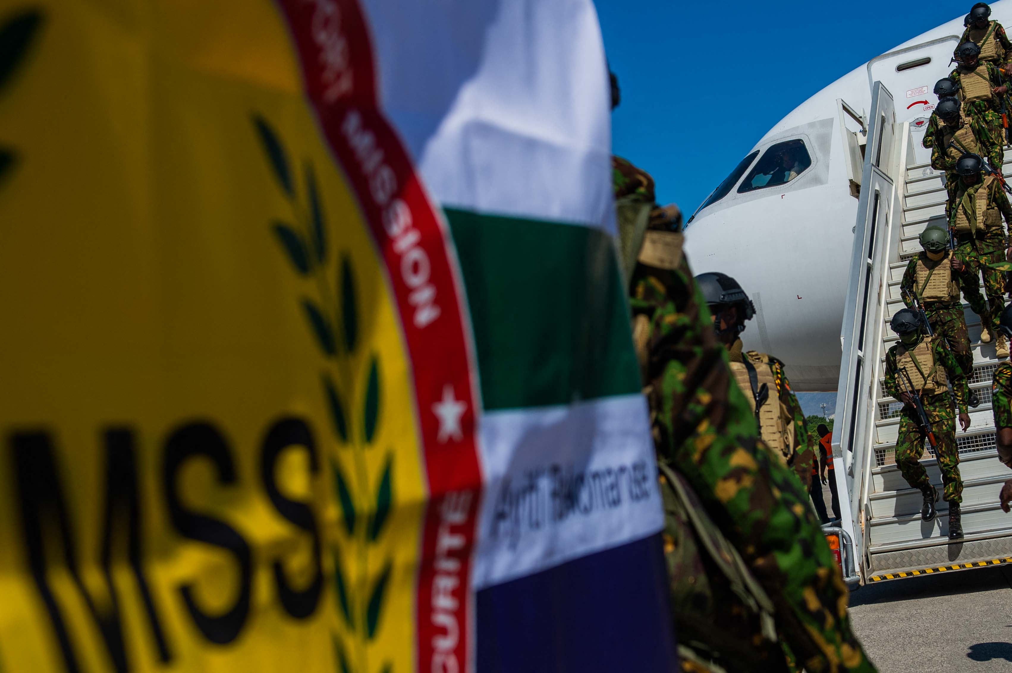 A contingent of police officers from Kenya arrives at Toussaint Louverture International Airport in Port-au-Prince, Haiti