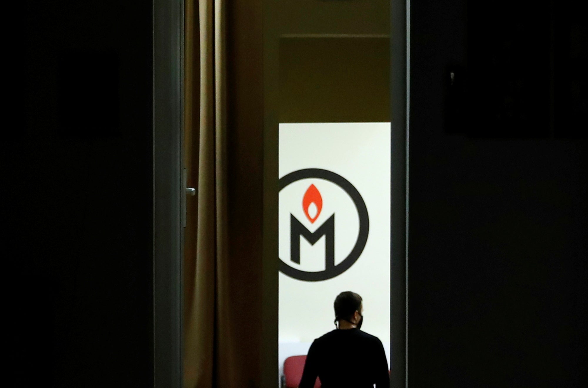 A man walks inside an office of the human rights group Memorial in Moscow, Russia December 29, 2021. Picture taken December 29, 2021. REUTERS/Evgenia Novozhenina