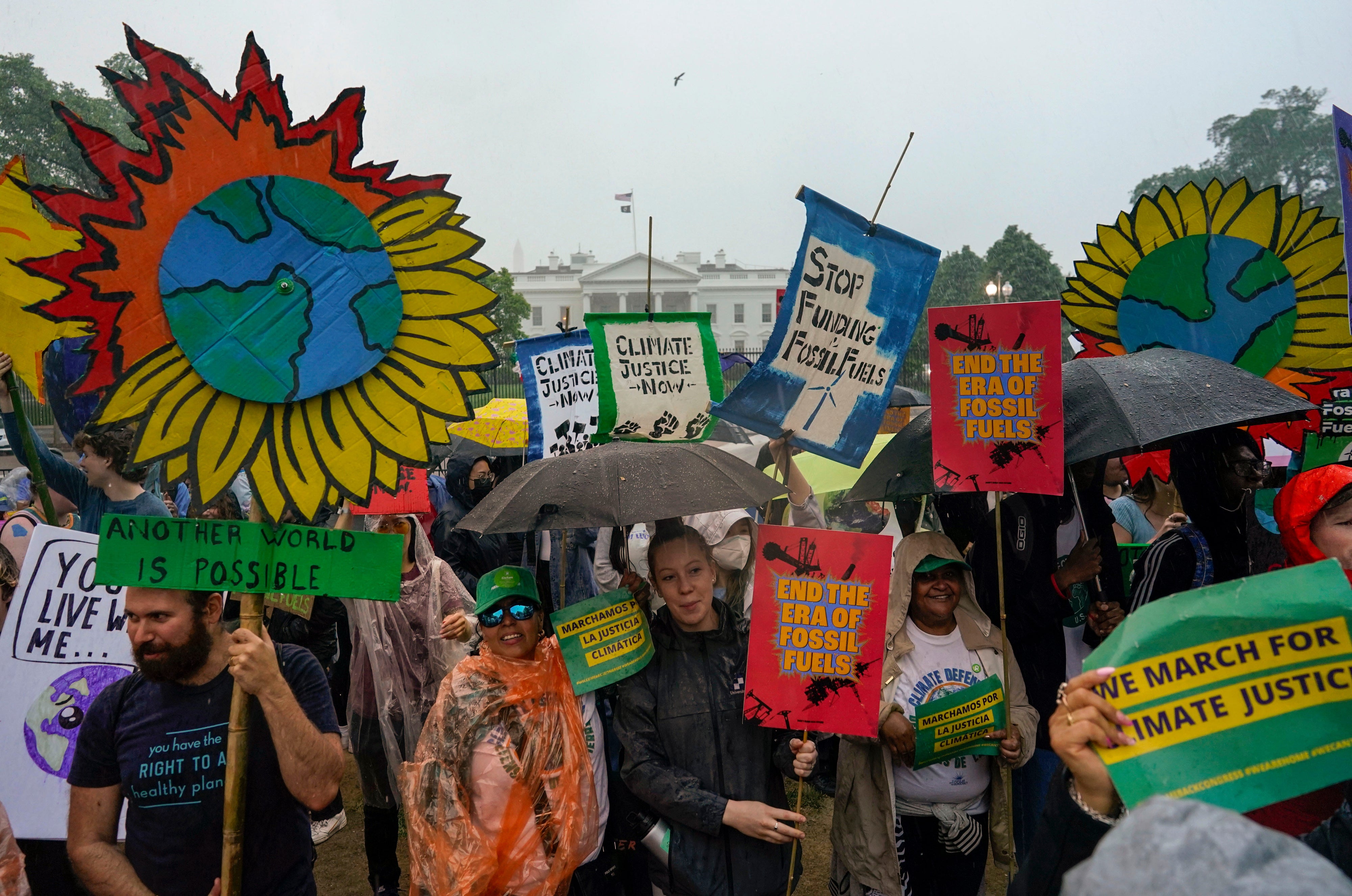 Climate activists hold a rally to protest the use of fossil fuels in front of the White House