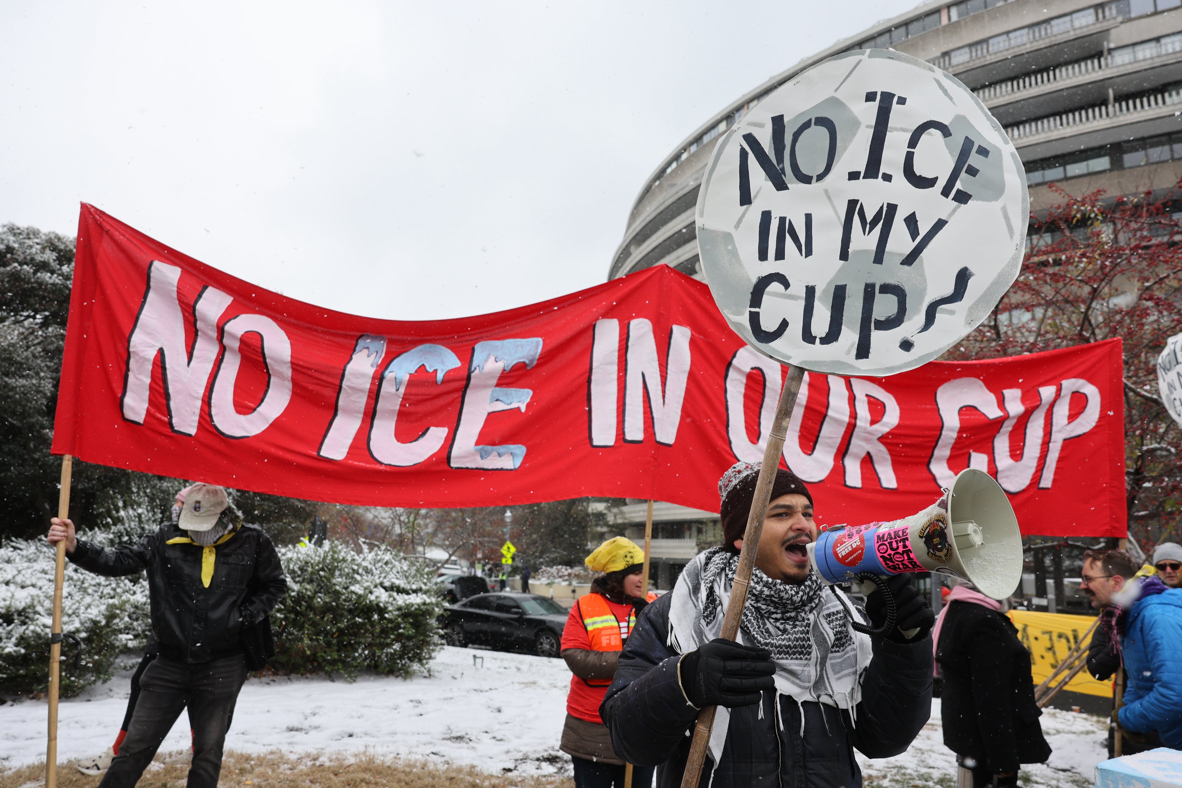 Demonstrators against the FIFA 2026 World Cup draw take part in a protest called "No ICE in my Cup!", in Washington, December 5, 2025.