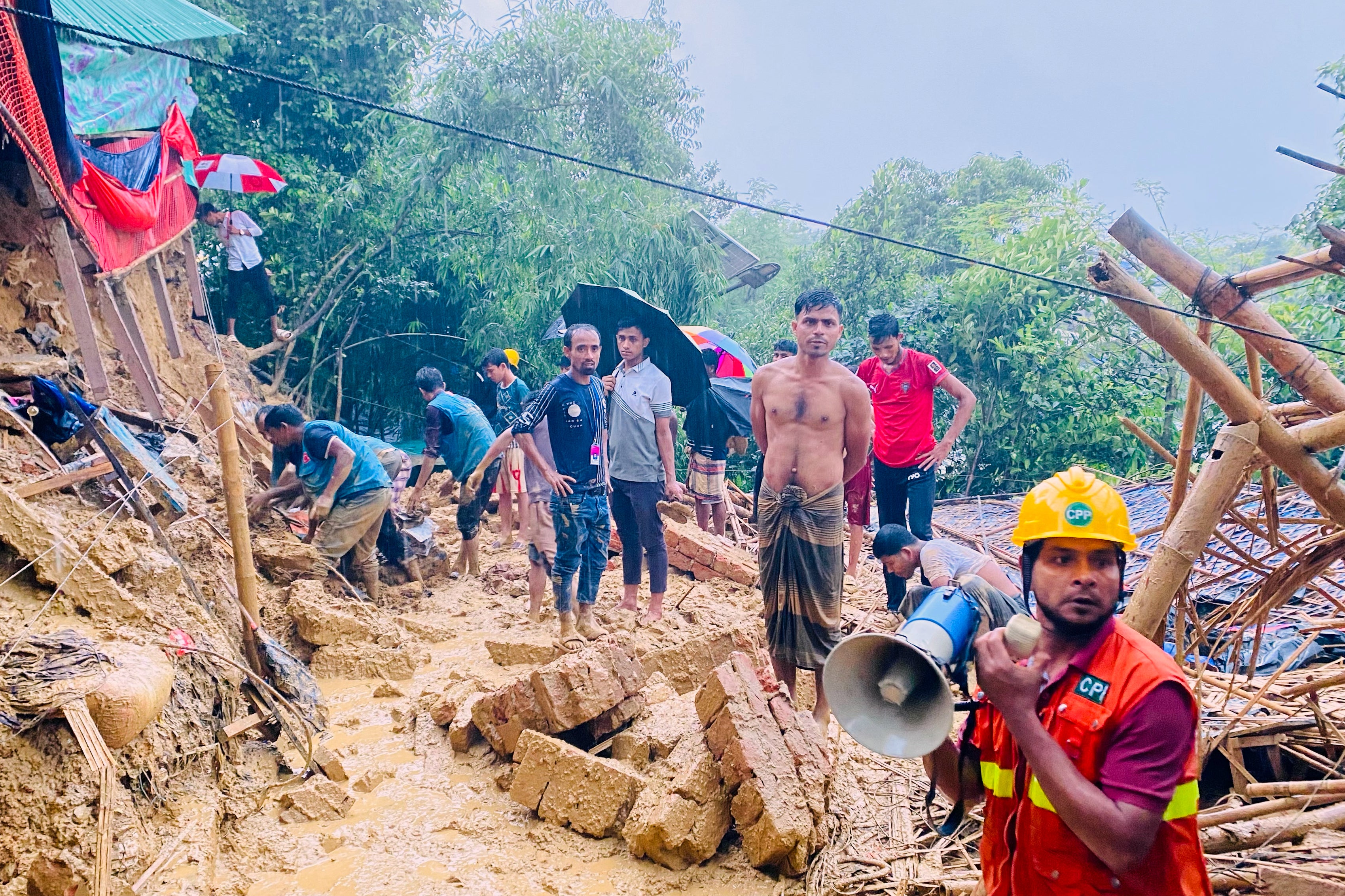 Rescuers work at the site of a landslide at a Rohingya refugee camp in Cox's Bazar, Bangladesh,  July 8, 2026.