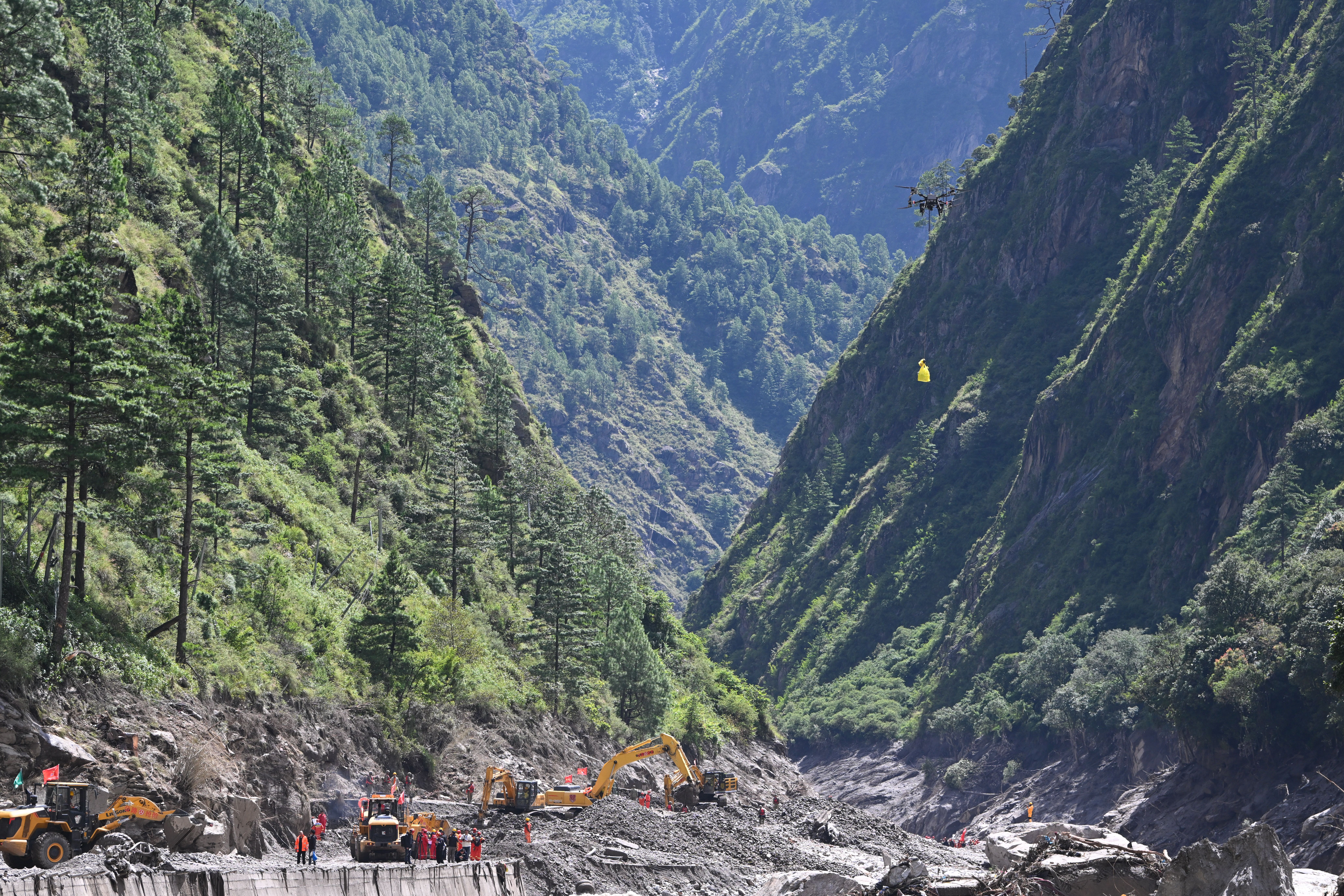Rescue workers use drones to deliver supplies at Gyirong Port in Tibet, August 28, 2026.