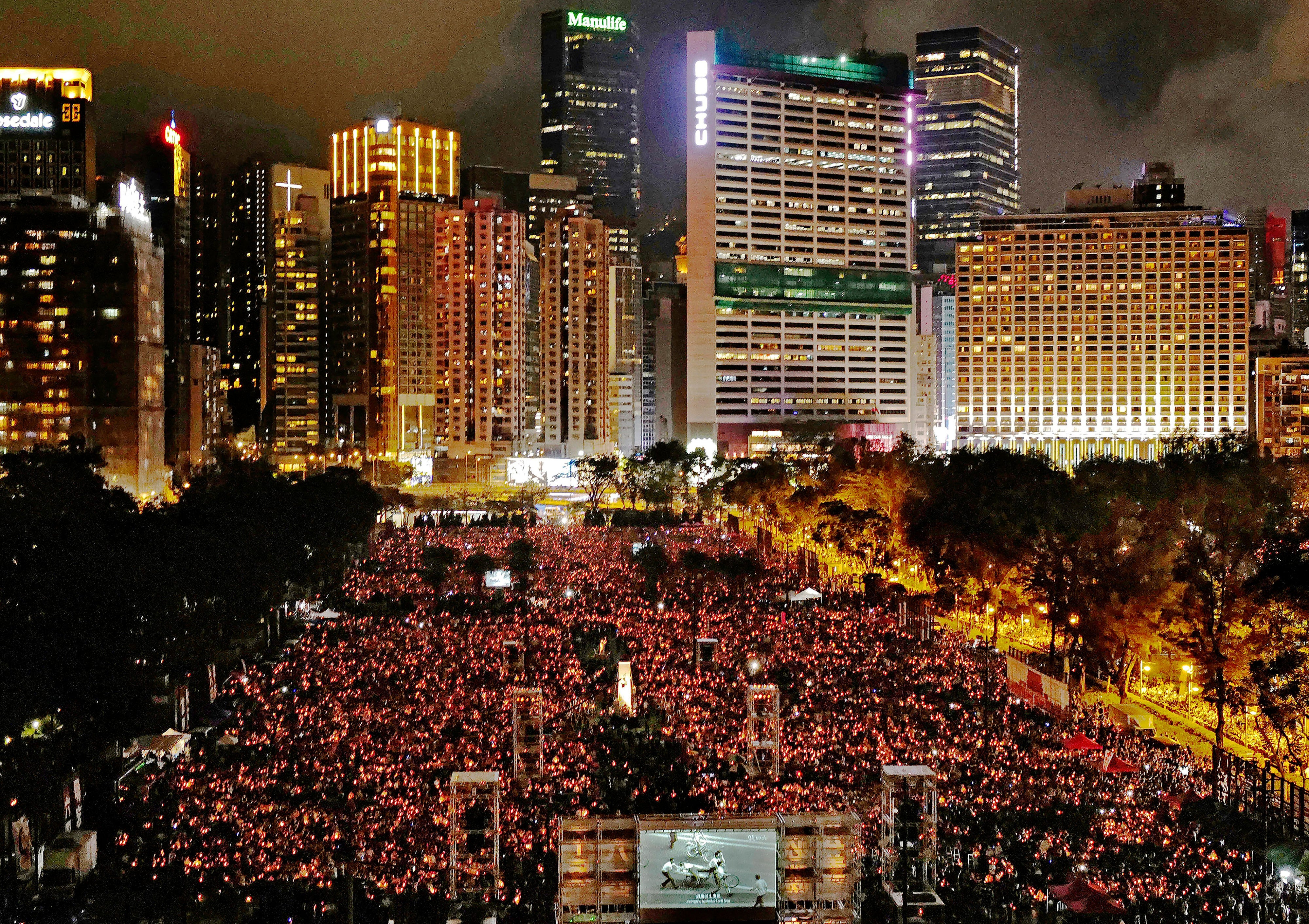 People attending a candlelight vigil