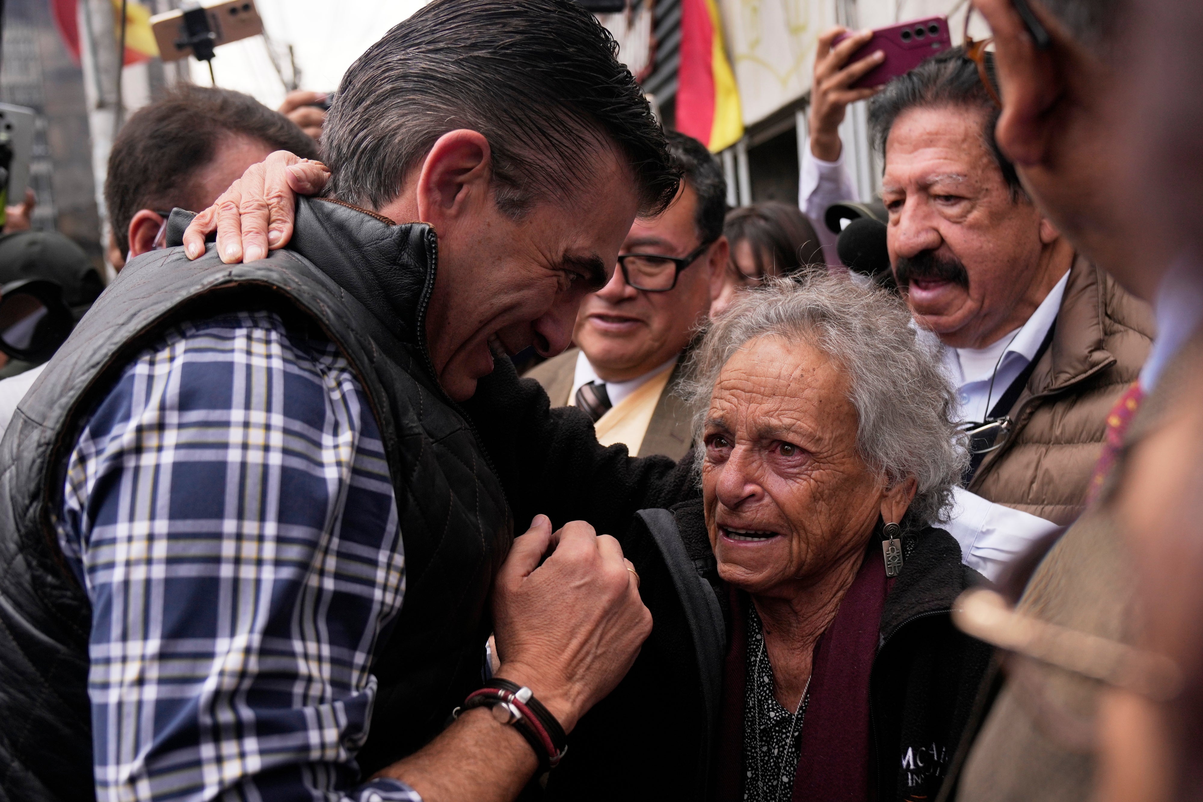 Bolivian President Rodrigo Paz (left), meets with activist Amparo Carvajal before entering the offices of the Permanent Assembly of Human Rights of Bolivia (APDHB), in La Paz, Bolivia, November 20, 2025.